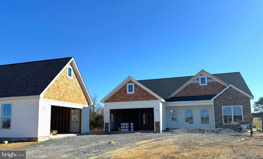 Customized rancher on 1acre culdesac lot with great pond views.  Just over 1700 sqft rancher offering open floor plan with vaulted ceilings in main living areas, 10ft ceilings in bedrooms, and tray ceiling in Primary Bedroom with recessed lights. The Primary Bath features large dual head tile shower . Kitchen is upgraded with large center island, custom quartz countertops, Stainless steel appliances, and upgraded cabinetry including pantry. The 14x16 sunroom with vaulted ceiling and gas fireplace with stone opens to large 25x14 rear covered porch.  Front porch, stone on front of home, 2-car attached garage and additional 2-car detached insulated 24x28 garage, and paved driveway are all included.  Many customized extras built into home.  Builder offers $10,000 towards purchasers closing cost.  *Interior Photos are similar construction