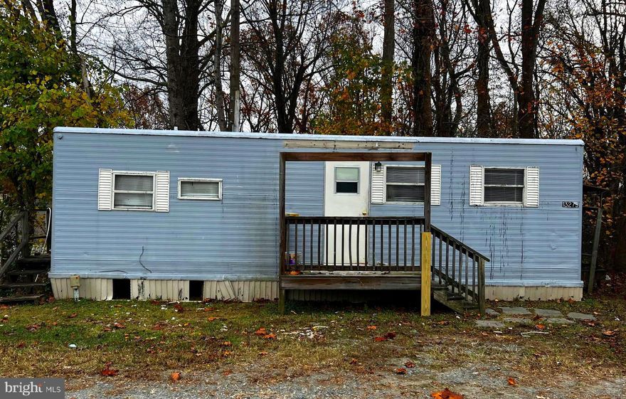 This charming studio trailer has been thoughtfully renovated to offer a cozy and modern living space. Located in a serene and peaceful setting, it features an open-concept floor plan, perfect for someone seeking a low-maintenance, yet stylish living arrangement. Upon entering, you'll notice new vinyl plank flooring throughout, providing durability and a sleek, contemporary look. The kitchen has been fully updated with new countertops and cabinetry for ample storage. Whether you’re looking for a compact and stylish full-time residence, a weekend getaway, or an affordable alternative, this renovated studio trailer is a perfect choice.