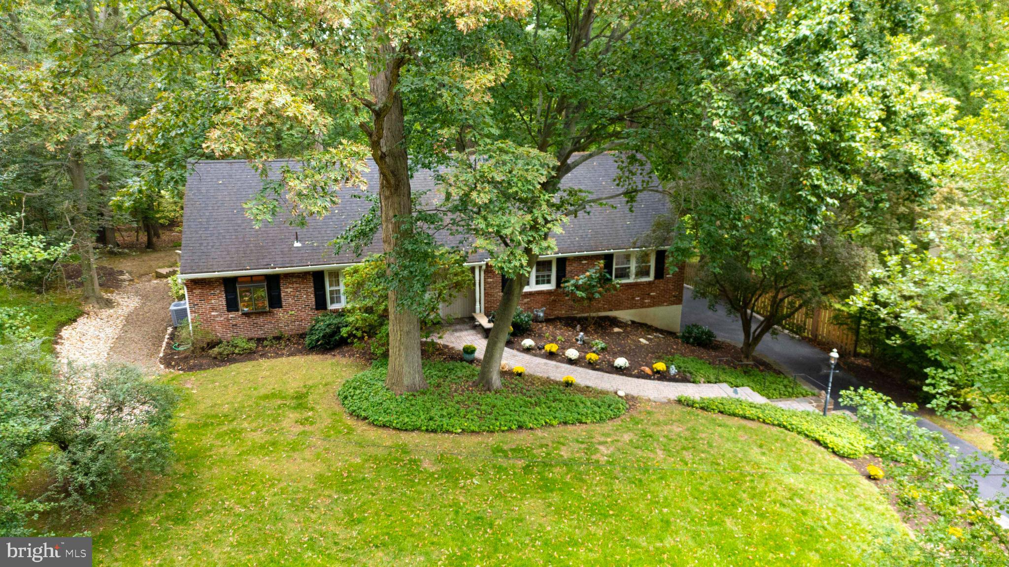 Nestled in the prestigious Frazier Woods community, this exquisite 4 bedroom, 3 bath raised ranch offers a harmonious blend of luxury and comfort. Set on a generous 0.58-acre lot, the home is surrounded by a private wooded lot that adjoins the picturesque Huntingdon Valley Country Club. The center hall entrance leads to a bright & cheering living room with cozy gas fireplace, crown moldings, and beautiful wood floors. The living room boasts large windows that open to the deck and wooded rear lot allowing enjoyment of the natural beauty surrounding you. There is a classic formal dining room with chair rail and wood floors. The kitchen is fully equipped with wood cabinets, tile backsplash, gas cooking, breakfast bar and a greenhouse window. Adjacent to the kitchen is a cozy den with bay window, crown molding and wood floors. Completing this level are 3 bedrooms and 2 baths with one of the bedrooms having their own private bathroom. The second level offers a main bedroom suite with excellent closet space, a large bath with vanity, jetted tub, accent lighting and greenhouse window overlooking the wooded lot. The lower level offers additional living space including a family room, work out area, laundry room and ample space for a workshop or recreational area. With a thoughtfully designed layout, the property features an attached 2 car garage with side entry, ensuring convenience and ease of access. This residence is not just a home; it's a lifestyle, offering the perfect backdrop for creating cherished memories. Embrace the opportunity to make this exceptional property your own.