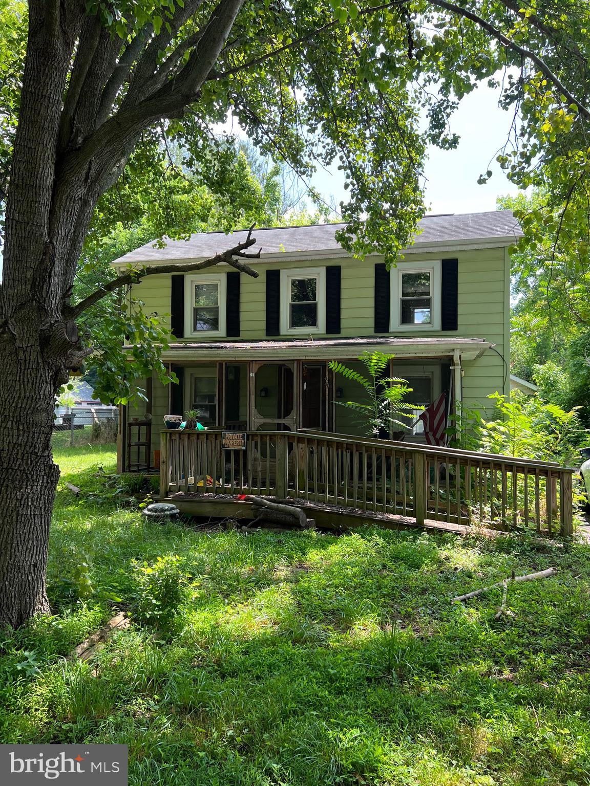 ATTENTION INVESTORS AND DIY'ERS! This charming home with so much potential is located second from last on a dead end lane. Huge 24x24 detached 2-car garage WITH ELECTRIC and cement floor featuring above head storage with pull down steps to access, and also a shed sized 12x24. UV Water Filtration system just added within the past year. There is an ADT home security system already wired on the home. Comcast available for high speed internet! Paved driveway, screened in front porch, and rear exterior deck. First floor features the living room, half bath, kitchen, laundry room and full bath. The home has 3 entrances, front door, side door through laundry, and sliding door to living area from deck. Home could easily be made into 2 bedrooms, with existing bedroom on second floor and lounge room adjacent. Less than 2 blocks away is the Post Office, Volunteer Fire Department, and small local store. Potomac River, Historic Harpers Ferry, shopping, and amenities all within close proximity while being off the beaten path! PROPERTY IS SOLD AS-IS!