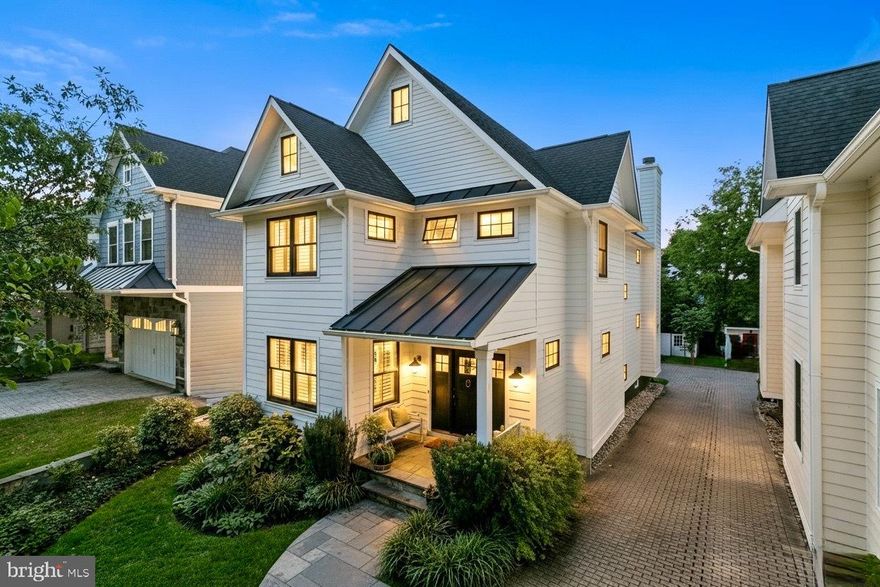 Exceptional Custom Home in the Heart of Falls Church City!

Custom-built in 2012 by Little City Builders, this exceptional residence blends timeless design with modern comfort in one of the city's most desirable neighborhoods. Featuring 5 bedrooms and 4.5 baths across a spacious, light-filled layout, the home offers elegance, warmth, and functionality.

Highlights include 4-inch hickory hardwood floors, detailed millwork, recessed lighting throughout, and freshly painted interiors. The chef's kitchen with stainless-steel appliances opens to a bright family room anchored by a wood-burning fireplace framed with natural stone and a wood mantel. A second gas fireplace, compacted by wooden book shelving, adds character to the formal front living room. Built-ins, ceiling fans, and three laundry stations, including one in the owner's closet, showcase thoughtful design.

The lower level also features a windowed bedroom, full bath, kitchenette, and elegant tiled floors with walk-out access to the rear yard. The top-floor bedroom enjoys its own bath, an ample seating area, and a skylight that brings generous brightness to the space.

Outside, the home's crisp white cement composite siding contrasts beautifully with black windows, creating striking curb appeal. The welcoming front porch, rear parking, and manicured yard complete the picture.

Set on a quiet, tree-lined street just moments from downtown Falls Church's cafes, restaurants, and shops, and within top-rated Falls Church City schools, this is a rare opportunity to own a design-forward home in The Little City.