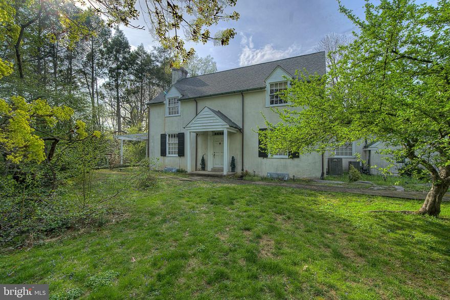 Heart of Flourtown. This 2,911 square foot, 3 Bedroom 2.5 Bath two story center hall Colonial sits on a bucolic 2.68 Acres. There is potential to subdivide off a lot in the rear with access to Cedar Lane.  Approach along the long gravel driveway. Plenty of parking, and a detached car port for cover. The homes original garage was converted into a spacious Family Room, enter here on the side of the home as the owners have done for years. This room has a brick feature wall, and sliders to the rear yard with wonderful views. Large Closets for storage! Continue into the kitchen, a cheery eating area to the left as you find the updated cabinetry at the end of the room with Quartz countertops, Bosch Dishwasher, Bosch Gas Range and Bosch Refrigerator. The kitchen (renovated 2016) wraps around to a Storage  Room / Pantry / Laundry Room. Continuing off the kitchen is your choice of a Small Den with half bath or access to the front formal Dining Room. Original Hardwood Floors. Both the Den and Formal Dining Room lead to the front Foyer. Here you can enter into the Formal Living Room with Dutch Doors, recessed lighting, wood burning fireplace and random width hardwood flooring. We now head upstairs. Two good size secondary bedrooms, a full hall bathroom with original ceramic tile. The master bedroom does have a walk in closet and a small en suite bathroom with stall shower.  Walk up Attic. 200 Amp Electrical. New Roof 2016. New Central Air 2016. Owner is sad to go, and hopes next owner will appreciate the beauty and quiet of this amazing property. Make an appointment today!
