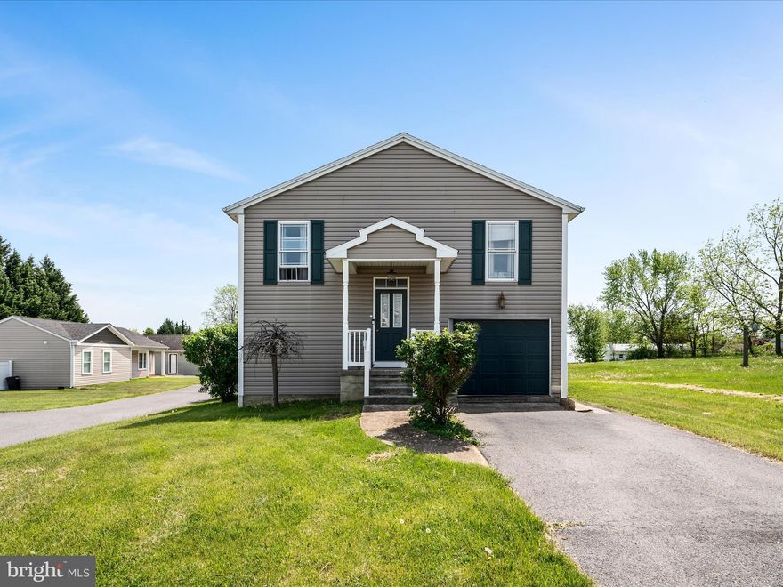 Located right across the street from the Berkeley County Rec Center and just minutes from I-81, this 3-bedroom, 2-bath home offers convenience, comfort, and flexibility. Set on a level lot with a one-car garage, the home features an open-concept main level where the kitchen flows seamlessly into the dining and living areas—ideal for everyday living or entertaining. The primary suite includes a private full bath and walk-in closet, while two additional bedrooms share a second full bath. The finished lower level adds valuable space with a cozy family room, laundry area, and a large storage room. With no HOA, you’ll enjoy added freedom and fewer restrictions. Don’t miss this opportunity!