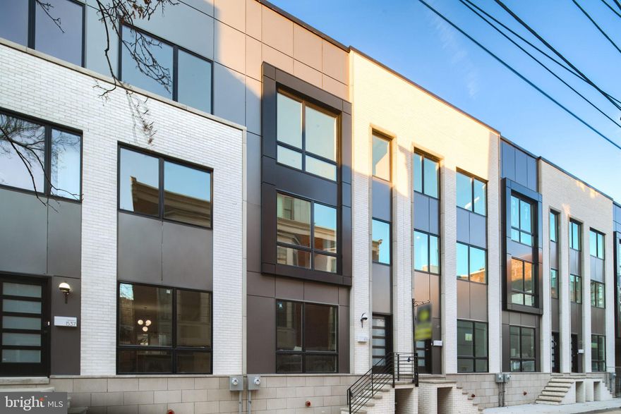 Welcome to the Royal Townhomes at Kater Street! With TWO of seven amazing new construction townhomes remaining just a block off of  South Street's many amenities. Each home features a 10 year tax abatements plus two car garage and is located in the desirable Greenfield School Catchment.  As soon as you enter you will be greeted by the warm, wide plank white oak floors that can be found throughout the home. To your left is the bright and spacious living room and open concept dining area to follow. The kitchen boasts a Sub-Zero & Wolf appliance package with a stunning built in refrigerator, drawer microwave, and 6-burner gas stove top with plenty of counter space on the gorgeous quartzite countertops. Down the stairs is a fully finished basement that would make for a lovely home office or playroom with an additional half bathroom adjacent and a door to the two car garage with rear access. The second floor hosts two spacious spare bedrooms with large closets and lots of light, as well as a shared hall bathroom and laundry room. Walk up the stairs and enjoy a cold drink at the wet bar on your way to your primary bath with a double sink vanity and a water closet. To your left is the primary bedroom with a walk in closet and huge windows. Last but not least is the roof deck with a green roof area.
These homes are one of a kind new construction...Don't miss out on your chance to own a home in Graduate Hospital with 2 car parking!!
**The taxes are not yet established and are estimated. **