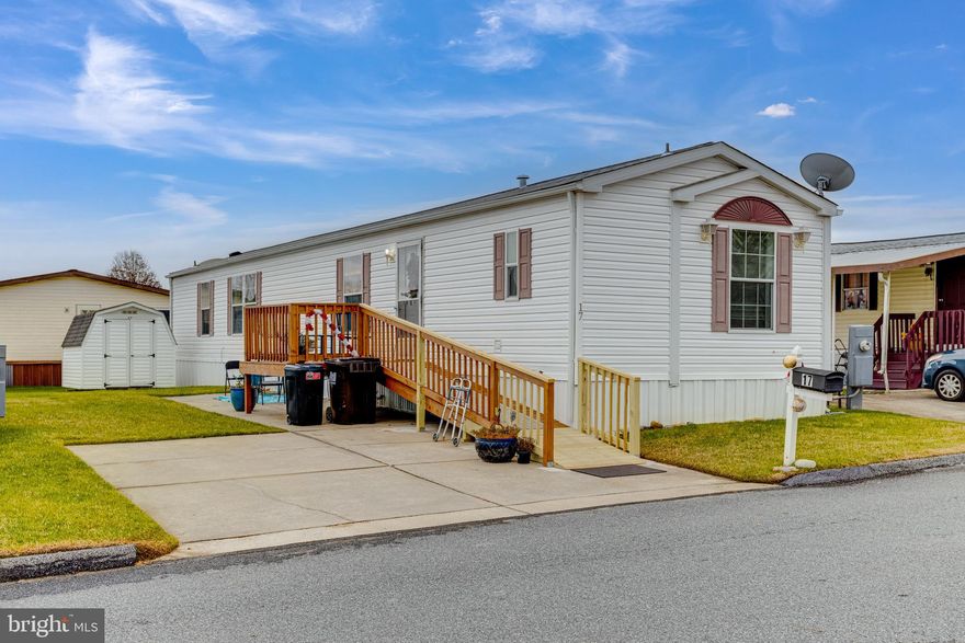 Welcome to 17 Mango Trail located in Biscayne Bay. This stunning mobile home is a two (2) bedroom (2) bathroom. This home has a new ramp that leads you to the front door. Upon entering the home there is a spacious living room, that is open to the kitchen and dining area. Laundry facilities are by the back door. There is a parking pad and a generous sized shed. This is being sold as is. Must be park approved.