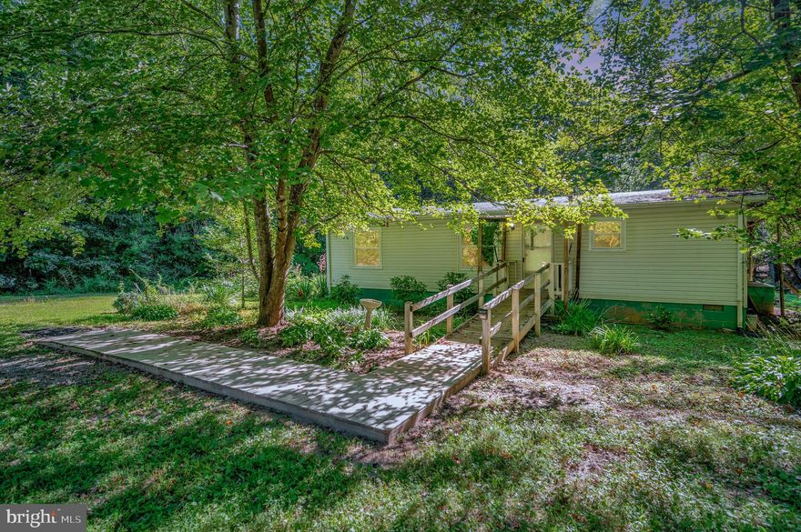 One level Rambler situated on 5 acres of beautiful land. This home offers 3 bedrooms and 2 full bathrooms. Eat in kitchen. No carpet. Newer items that have been done are, plumbing 2021, new windows approx 5-6 years, hot water heater approximately 5 years, heat pump 2017, New panel box 2017. Septic pumped about 3 years ago.  There is a ramp at the front, but could easily be removed if not needed. The property boasts mature landscaping with multiple Crape Myrtles and an abundance of hostas. A storage shed is also included.  There are things to do close by, such as Fifty Third winery, Cooper Vineyards Shop, Boswell's  Tavern  or go check out Lake Anna and historic downtown Louisa.  Don't forget about the Annual Fall Festival or Light up Louisa & Holiday Window Display contest or the Louisa Christmas Festival & Parade.  Take a 45 minute drive and you can be in Gordonsville.