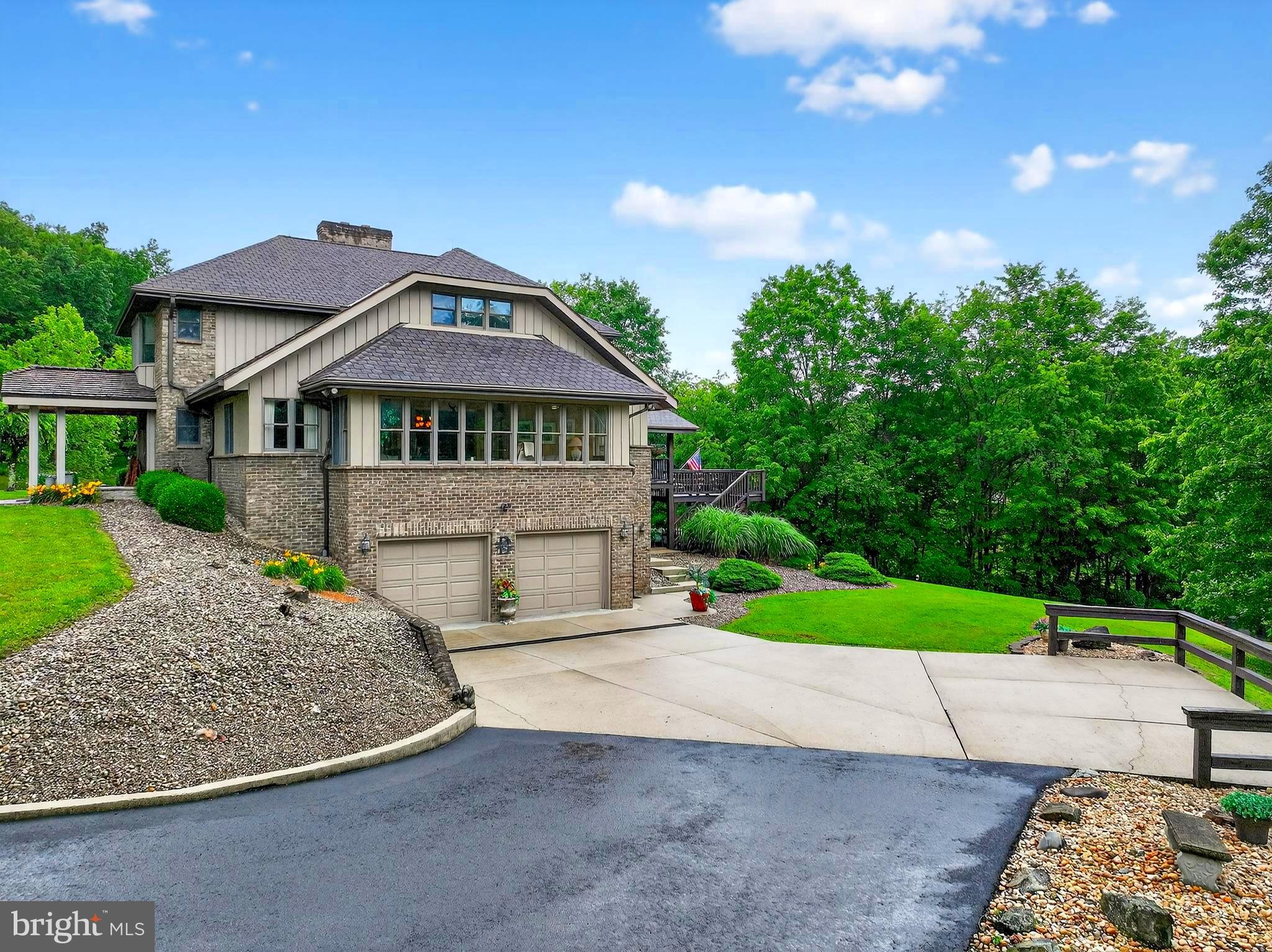 "Elite Elkins Home" 6,600 +/- sqft nestled on over 2 ACRES! Experience exceptional living at 201 Westridge Dr., where comfort and community converge in a classic home. This spacious home features four bedrooms, including a luxurious primary suite on the main level with two attached full bathrooms for ultimate privacy and convenience. With a total of four full baths and one half bath, there’s ample space for family and guests. The main floor impresses with soaring high-beamed ceilings and a dramatic floor-to-ceiling brick fireplace, creating a warm and inviting atmosphere. Enjoy the versatility of a loft and three additional bedrooms on the second floor, perfect for family or visitors. The four-season room, surrounded by windows, offers year-round enjoyment of the outdoors from the comfort of your home. Additional highlights include an elevator, a partially covered two-level back deck, and a covered front porch—ideal for relaxing or entertaining. The full basement is designed for fun and productivity, featuring a game room, bar, and office space. Located in a vibrant community with amenities such as a pool, pond, and tennis courts, this property offers the perfect blend of private retreat and active lifestyle. 30 +/- miles to Canaan Valley Resort & Timberline Mountain. 40 +/- miles to Snowshoe Mountain Resort. Monongahela National Forest in all directions.