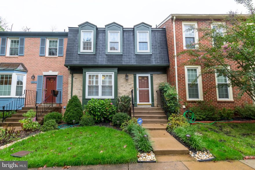 STUNNING 3 LEVEL BRICK TOWN HOME METICULOUSLY CARED FOR IN POPULAR ARROWOOD COMMUNITY. LOCATED CONVENIENT TO MAJOR COMMUTER ROUTES. LARGE EAT IN KITCHEN W/GRANITE COUNTERS & UPGRADED CABINETS, TILE FLOORS, HARDWOODS IN DINING ROOM, 3 BEDROOMS, 2.2 BATHS, LARGE MASTER BEDROOM, GORGEOUS BASEMENT FAMILY ROOM W/ BRICK FIREPLACE, BUILT IN  BOOK SHELF'S THAT WALKS OUT TO REAR PATIO & FENCED YARD.