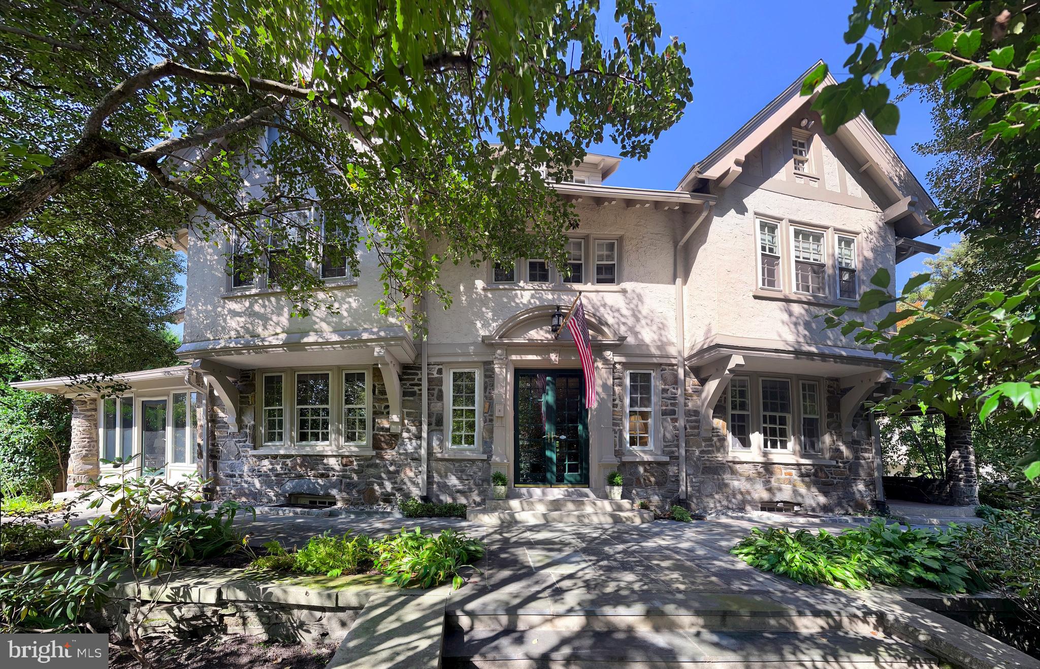 Welcome to 122 Mill Creek Road, a stately stone Colonial home brimming with original character and versatile living spaces. This expansive property features at least 5 bedrooms and 4.5 baths, with numerous additional rooms that can be tailored to your needs—whether as bedrooms, offices, or hobby spaces. Situated on .52 acres, this residence offers a unique combination of historic charm and boundless opportunity.
This home offers the convenience of being within walking distance to Suburban Square, a premier lifestyle destination featuring a curated mix of retail and unique dining options. Additionally, the nearby Ardmore train station provides a short ride to Center City Philadelphia, enhancing your lifestyle with easy access to urban amenities.
Upon entering the home, the first floor greets you with a grand foyer, leading to a spacious living room, formal dining room, and a sunroom that invites natural light and tranquility. The kitchen and family room are thoughtfully positioned at the back of the home, offering a seamless flow for entertaining. A powder room completes this level.
The second floor boasts 5 bedrooms, including a sunroom off one that makes for a perfect office or sitting area, along with 3 full baths and a convenient second-floor laundry.
The finished third floor provides 4 additional rooms and a full bath, with two rooms currently configured as offices. This home also features six fireplaces, adding warmth and character throughout.
The detached garage includes a finished space above, complete with an old clawfoot tub and roughed-in plumbing—ready for your renovation vision.
While this home does not have air conditioning, it is equipped with gas heat. With its timeless moldings, detailed craftsmanship, and abundant potential, this property is a rare opportunity to create your dream home in a storied setting.