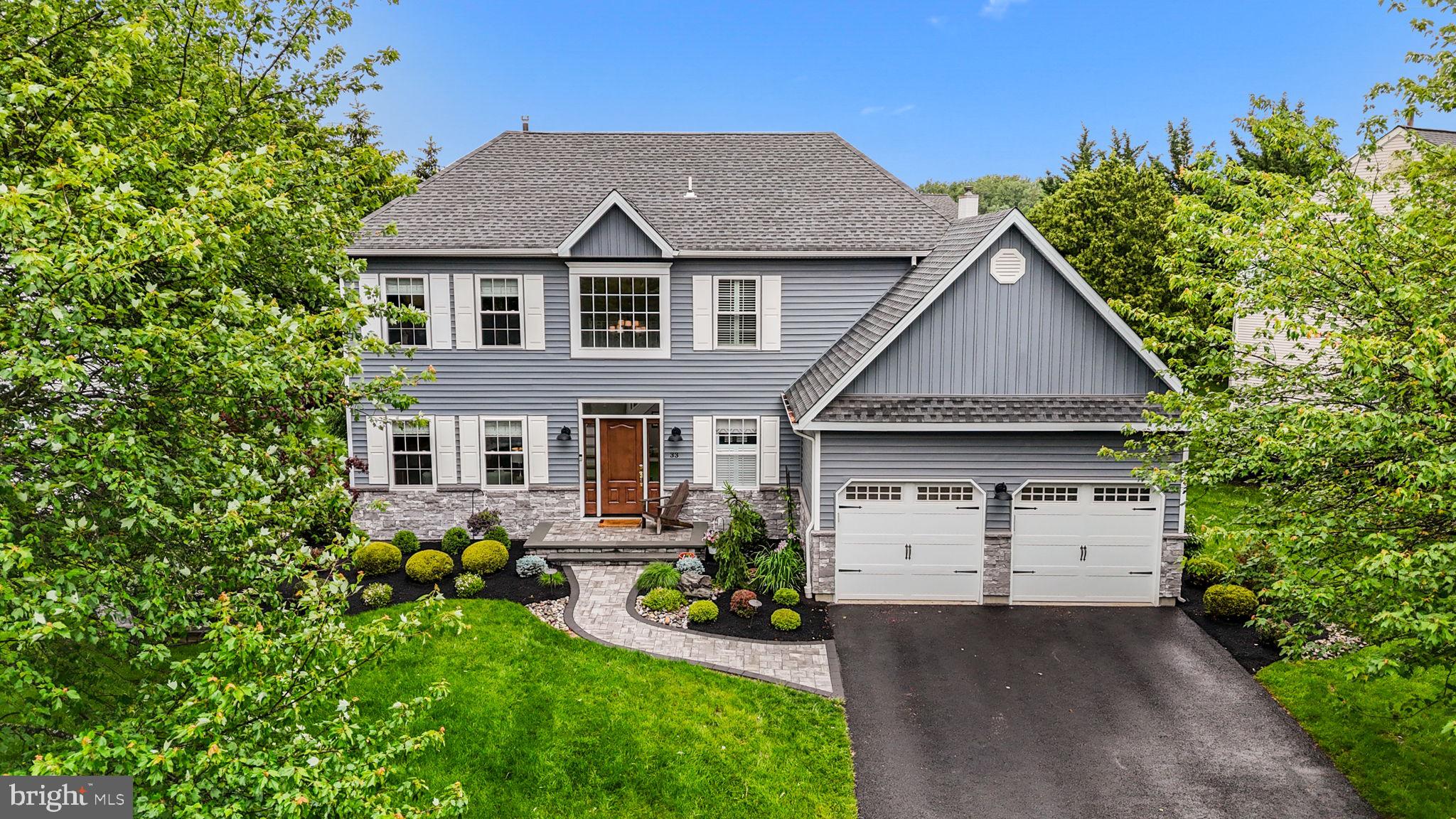 Absolutely gorgeous, upgraded, move in condition Colonial in the Fawn Hollow section of Newtown Grant! Curb appeal like no other! New siding and front walkway (2023) set the tone for this impeccable home (front landing has footings for a Portico if desired); 2 story entry with charming turned stairway with custom railings; large powder room with high end finishes; custom hardwoods throughout entry, living room, dining room and kitchen; formal living room with stone wall electric fireplace, built-in bookshelves and window seat nook; formal dining room with beautiful modern light fixture; remodeled kitchen with granite countertops, stone tile backsplash, center island, new Wolf oven (2023), Bosch dishwasher (2022), and breakfast room with vaulted ceiling and skylights; step down family room, a remodeled laundry room/mudroom with interior access to the 2 car garage with epoxy floor and custom storage features complete the first level of the home; the second level features a landing and hallway with hardwood flooring; the primary bedroom suite is luxurious with hardwood flooring and an en suite bath that has the feel of a luxury hotel with sliding barn door, double sinks, soaking tub and large glass shower stall; 3 additional bedrooms and a remodeled hall bath complete the second level; the basement is finished with an office, an entertaining space, as well as an unfinished section for storage; a rear covered porch with vaulted ceiling overlooking the rear yard offers outside options no matter the weather; Newtown Grant offers community pool, recreational fields, tennis/pickleball courts, and much more...located in the Council Rock School District!....only minutes from Historic Newtown Borough, Tyler State Park, Newtown Shopping Center....other upgrades include: Whole house generator (2022), new garage doors (2023) and garage redone (2024), laundry room (2023), stairs and powder room (2018), roof (2017), 2nd floor hall bath (2019), primary bath and closet (2020), living room (2021) with electric f/p; water heater (2023), HVAC (2018), Wolf oven (2020), Bosch D/W (2022), hurry on this one as it won't last long....