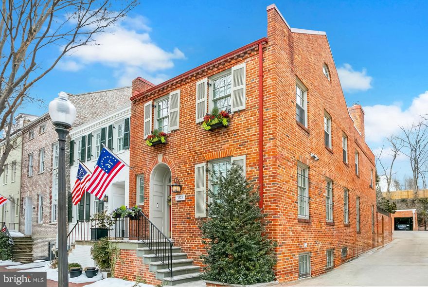 Rarely does a residence offer the elusive combination of semi-detached privacy alongside a comprehensive, designer-led renovation completed in 2025. Bathed in natural light from three exposures, this Georgetown townhouse has been dramatically reimagined with a fresh layout that prioritizes the standout features: light-filled views to the charming rear garden, a full lower-level suite, multiple outdoor spaces and a professional grade Chef’s kitchen that includes comfortable space to relax and gather.

A proper entry foyer with artisanal marble tile and adjacent recently-renovated powder room leads to the dining area and living/family room. The open floor plan allows for easy differentiation of spaces while maintaining a natural flow.

A step-down kitchen with floor to ceiling French doors overlooks a professionally designed rear garden with an utterly charming terrace cottage replete with window boxes. A total renovation of the kitchen was completed in April 2025, providing a final product that is as functional as it is stunning. A Moroccan tile backsplash, custom fabricated range hood, and Frame TV over the leathered-marble hearth provide timeless beauty, while the 6-burner range plus grill, double oven, built-in wine fridge and custom built-in cabinetry provide practical utility for a true Chef. Generous bar seating at the island, along with built-in banquettes provide ample space for gathering.

On the second level, the newly-renovated Primary Suite overlooks the rear garden and features extensive custom cabinetry to maximize storage space while maintaining an elegant aesthetic. The ensuite bath with frameless shower and dual vanity is clad in marble and features designer plumbing fixtures. A stackable washer and dryer within the primary suite provides total convenience. The second bedroom includes a spiral staircase accessing the loft, expansive enough for a desk, study or wellness space. Loft access to the rooftop deck offers views as far as the Washington Monument and Kennedy Center. A graciously-scaled third bedroom, full hall bath, and linen closet complete the second level.

With private access from the street, the Lower Level offers a suite of its own including a full bathroom, sizable living space, walk-in closet, sleeping area and full eat-in kitchen. Off the secondary kitchen, there is finished storage space with a side-by-side washer and dryer. System updates throughout include new HVAC, wiring and duct work, as well as the roof on the rear of the property.

The location on Reservoir Road offers a specific Georgetown magic: close enough to walk to dinner and retail on Wisconsin Avenue, yet just far enough from the hubbub to enjoy a genuine sense of neighborhood quiet. It’s a short, pleasant stroll to the gardens at Dumbarton Oaks, Dupont Circle or the weekend farmers market at Rose Park. It’s the kind of block where you actually get to know your neighbors, all within the heart of the city.
