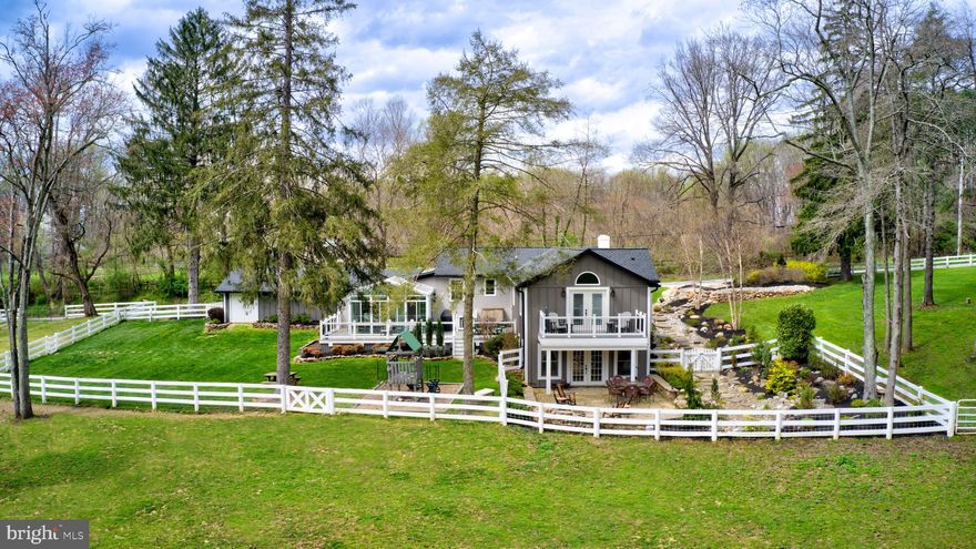 NEW PRICE, NEW ACREAGE. The quintessential farmette, on a quiet country lane in Phoenix, with Hereford Schools and just ten minutes to Wegmans, 83 and the NCR trail boasts over 4,000 of FINISHED LIVING SPACE.  You really MUST visit in person to realize the VAST scope of improvements & superb craftsmanship that has transformed this home into a charming yet modern day farmhouse.  This remarkably reimagined Rancher now embodies the years'-long collaborative vision of the Owners and master artisans to create a supremely charming, completely unique and rustically elegant country retreat!  Interior improvements & customizations include a newly-built all-glass Conservatory; custom hand-distressed wood builts-ins and wall accents and a handsome finished Lower Level w/ full Wet Bar, Rec/Exercise Room and Great Room. Revel in the peace of mind offered by nearly worry-free stucco & LP SmartSide board & batten exterior construction plus 1-year young 50-year GAF Timberline roofing/gutter/flashing system! The grounds and views are truly dreamy, offering a gurgling stream & foot bridge (open your windows for the meditative sound).  Extensive hardscape design perfectly pairs form with function and includes a gorgeous stone patio w/  hand-stacked fire pit (look for the "guitar rock"!), knee walls and perfectly placed walking stones. The reconstructed Barn is "postcard perfect" and now boasts a  Hay Loft, Stable, Water and Electrical Service, Tack Room, Utility Garage and adjacent Chicken House! Little ones can run safely inside the large fenced play yard...or get adventurous and take a ride down the zip line!  Enjoy the silver light of the evening the moon on this sylvan setting while you recline on the expansive Trex Transcend Composite deck, private Owners' Suite balcony or perhaps in the comfort of the climate-controlled Conservatory. No matter where you are on or in this property, the bounty and beauty of Nature is ever-present and tranquility surrounds you.  Experience the serenity for yourself! Additional parcel of 4.34 acres available for purchase. This parcel has potential for one building lot and includes a pond.