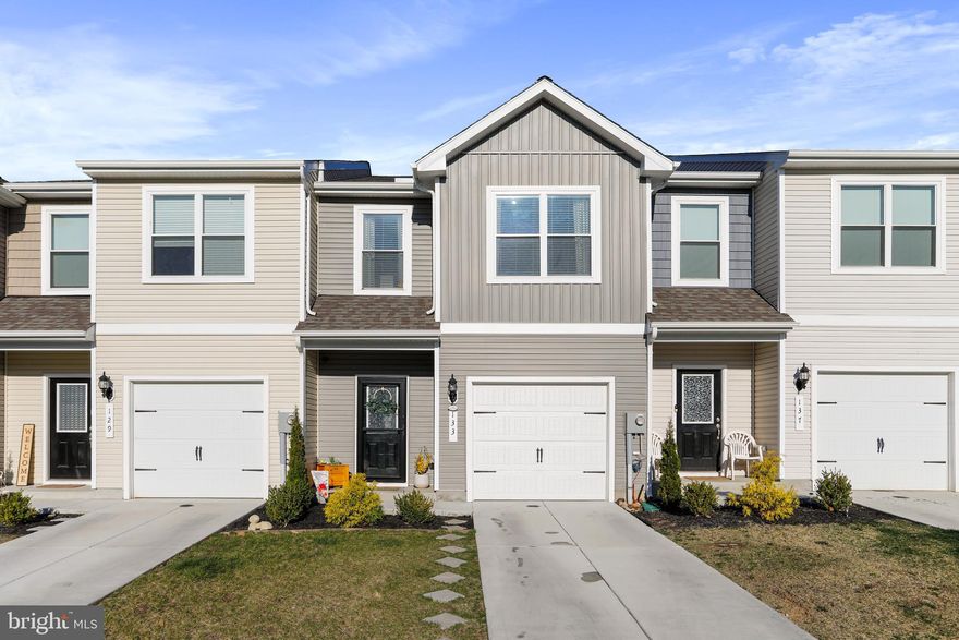 Why wait for new construction! This charming,  well maintained home was built in 2022! The heart of the home is the combination kitchen and living area, with granite countertops, lots of cabinet space and a large pantry. The kitchen is also equipped with 3 year young appliances, including a built-in range, dishwasher, and refrigerator, and the open concept ensures cooking and entertaining are a breeze.  Upstairs you will find an oversized primary bedroom with tons of natural lighting, huge ensuite that includes a soaking tub and stand-in shower, and a HUGE walk-in closet.  You will also find upstairs, two more  spacious bedrooms and another full bathroom- AND The laundry room is  conveniently located on the upper floor as well, to enhance the functionality of this home. This thoughtful design includes interior features such as; plush carpeting and stylish vinyl flooring that flows seamlessly throughout.  The backyard is also a great size and fully fenced in making it great for children and pets! The BEST part?? This home is just minutes away from I81, shopping, gas stations, and much more! This perfect commuter location is also just a short drive to the Hagerstown Valley Mall and Outlet Stores! Don’t miss the opportunity to make this beautiful townhouse your own—schedule a tour today and experience the perfect blend of comfort and style!