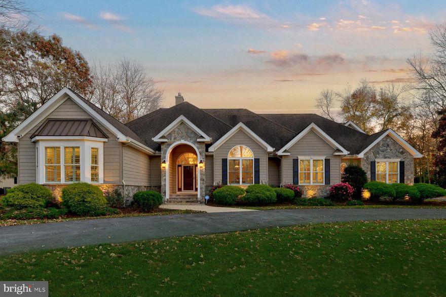 ****PRICE IMPROVEMENT *** BE AMAZED at this sprawling French Country home tucked into the aspirational PARKERS POINT community, just 30 minutes from DE ocean beaches!  Arrive via the circular driveway to the huge parking court adjoining the auto aficionado’s oversized 3-car/finished workshop garage.  The 4290 sq. ft. home offers 5 Bedrooms with walk-in closets and 4.5 well-appointed Baths with a flexible use upper level to accommodate a home theater, billiard room, and/or in-law/guest quarters!  Every glance reveals high-end upgrades including: NEW Kitchen appliances (GE Monogram); NEW LVP flooring; NEW countertops; striking designer light fixtures; NEW deck, paver patio oasis, and yard with high-end fencing; hot tub; and outdoor lighting for entertaining!  The open concept floor plan shares the Living Room’s stone fireplace ambiance with dining areas and chef’s Euro Kitchen w/island dining bar.  Add efficient geothermal heating/cooling systems and whole home generator for a remarkable priced-to-sell package.  Close to shopping, dining, cultural venues, nature parks, & RTs 1/13/50.  Just 30 minutes to the beach!