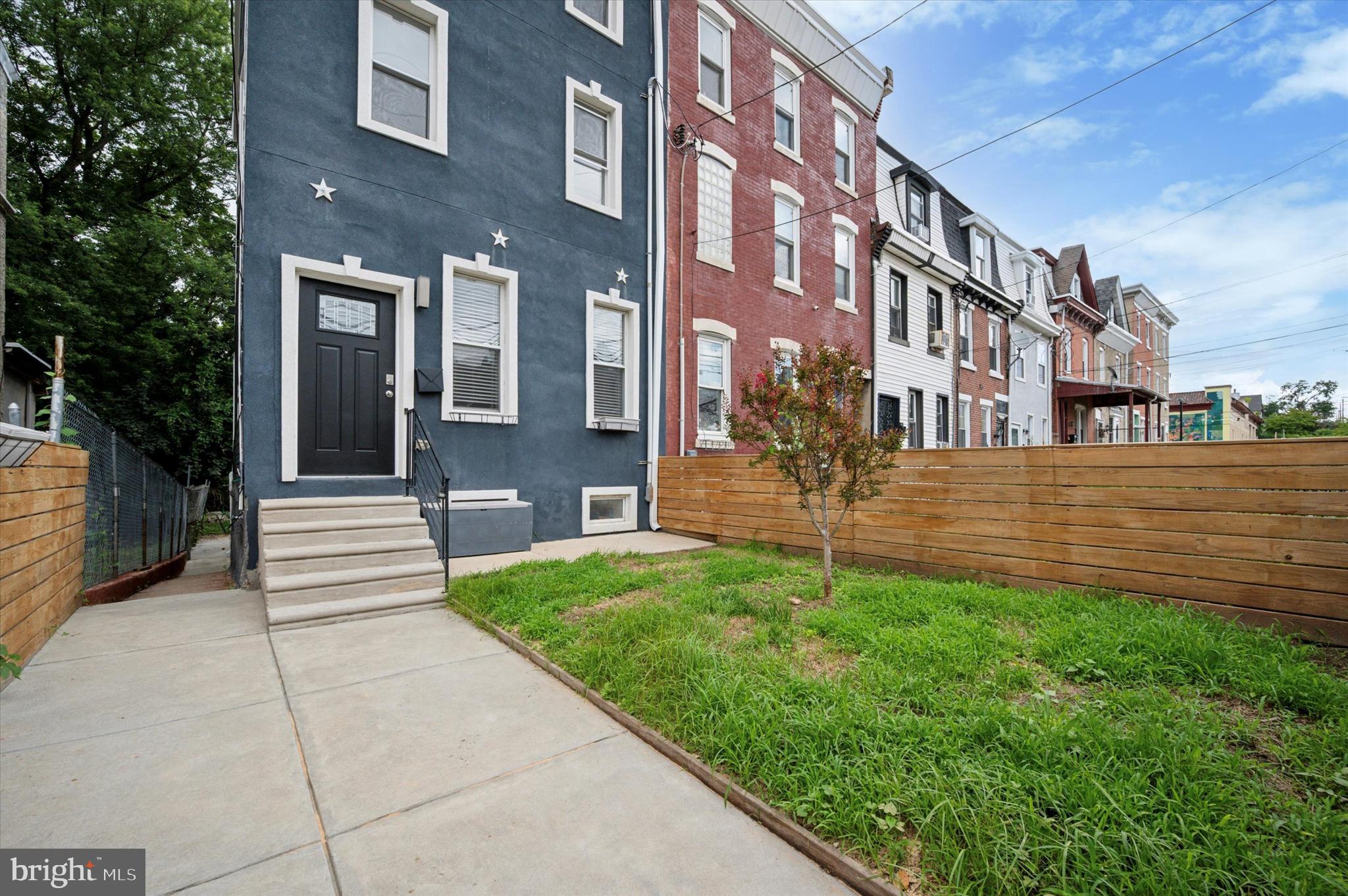 Welcome to 3525 W Allegheny Avenue, a stunning, fully renovated 3-bedroom, 2.5-bath, 3-story home in the rapidly developing neighborhood of Allegheny West just steps from East Falls and a 10-minute drive to Center City. This spacious and stylish home features an open-concept main level with a convenient powder room and a showstopping kitchen complete with a large center island, white quartz countertops, subway tile backsplash, stainless steel appliances, and a sleek stainless hood over the cooktop, all accented by elegant pendant lighting. Sliding glass doors off the kitchen lead to a rear deck overlooking a fenced-in backyard perfect for relaxing or entertaining. The fully finished basement offers tile flooring and ample space for a game room, home gym, or secondary living area. Upstairs on the second floor are two generously sized bedrooms, a full hall bath, and a conveniently located laundry room. The third floor is dedicated to a luxurious owner’s suite featuring a walk-in closet, private balcony, and a spa-like bathroom with double vanity, marble flooring, a soaker tub, and a large tiled shower. With updated mechanicals and abundant natural light, this move-in-ready home is an exceptional value in one of Philadelphia’s most accessible neighborhoods. Schedule your tour today!