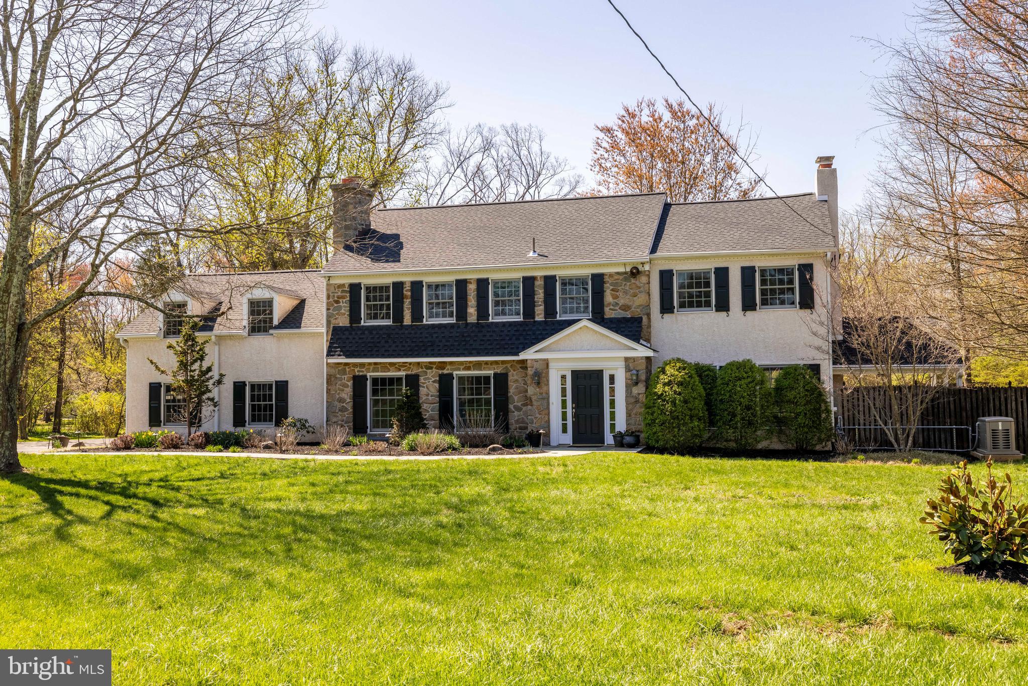 Welcome to this wonderful Lower Gwynedd residence, offering over 4,100 square feet of thoughtfully designed living space, complete with three fireplaces and a heated in-ground saltwater pool, all nestled on a serene and park-like 1.37-acre lot.
From the moment you arrive, a charming slate walkway guides you to both the front and side entrances, setting a gracious tone. Inside, the foyer offers a warm welcome, leading to a spacious living room on the right complemented by a large dining room on the left—each featuring a cozy fireplace and an abundance of natural light. The living room opens directly to a covered porch, perfect for enjoying the fresh air during spring and summer.
The thoughtfully renovated kitchen flows seamlessly into the windowed breakfast area and family room, creating a bright and open space ideal for everyday living and entertaining with picturesque views of the lush surroundings. The family room exudes warmth with rustic wood beams, a raised fireplace with brick surround, and a picture window overlooking the side yard. An inviting side patio near the kitchen offers a favorite spot for grilling and dining al fresco.
A versatile office or den sits conveniently between the main hallway and family room. Off the garage entrance, a spacious mudroom with a separate laundry area and extra storage helps keep things organized. A powder room completes the main level.
Upstairs, you’ll find five bedrooms and three tastefully updated bathrooms. The primary suite includes a walk-in closet plus two additional customized closets and a renovated en-suite bath. A wide hallway connects the additional four bedrooms and two baths, with the fifth bedroom offering flexibility as a guest suite, home office, or cozy pajama lounge. A cedar closet adds bonus storage to the second floor.
Important improvements elevate this home’s timeless appeal: public sewer and expanded natural gas line have been added, along with a full-house generator, new roof, and replaced windows. Hardwood floors run throughout the home, preserved under removable carpet in the upstairs hallway, bedrooms and stairs.
The heated saltwater pool, fully renovated in 2023, is fenced-in and ready to enjoy this summer. Over the years, this home has been the backdrop for countless cherished memories, including two weddings. It truly embodies a relaxed, welcoming atmosphere that makes it a joy to come home to.
Ideally located just steps from Lower Gwynedd’s scenic trails and only 0.6 miles from one of three SEPTA train stations to Center City, this home offers unbeatable convenience. It’s part of the award-winning Wissahickon School District, with both the high school and middle school accessible by a nearby trail. Enjoy proximity to terrific restaurants, shopping, and all your daily essentials.
Don’t miss the opportunity to make this exceptional property your forever home—schedule your showing today!