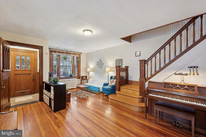 Welcome to this classic 4-bedroom, 1.5-bath twin home in the heart of Girard Estates. From the moment you step inside, you’ll appreciate the original hardwood floors, warm wood trim, and beautiful period details like a functioning pocket door between the formal dining and living rooms.

The spacious first floor offers distinct living and dining areas, a bright kitchen, a convenient laundry room, and a powder room tucked at the rear. Upstairs, you'll find four generously sized bedrooms and a full hallway bath with vintage tilework and tons of natural light.

The full, unfinished basement provides ample storage or the perfect opportunity to create a finished space tailored to your needs. Think rec room, home gym, or workshop. Out back, enjoy a low-maintenance yard and private outdoor space for relaxing or entertaining. With great bones and plenty of original character, this home offers the perfect canvas for your personal touch.

Situated on a quiet, tree-lined block, this home is close to parks, schools, shopping, and beloved South Philly staples. If you’re looking for space, charm, and potential in a sought-after neighborhood, this is the one!