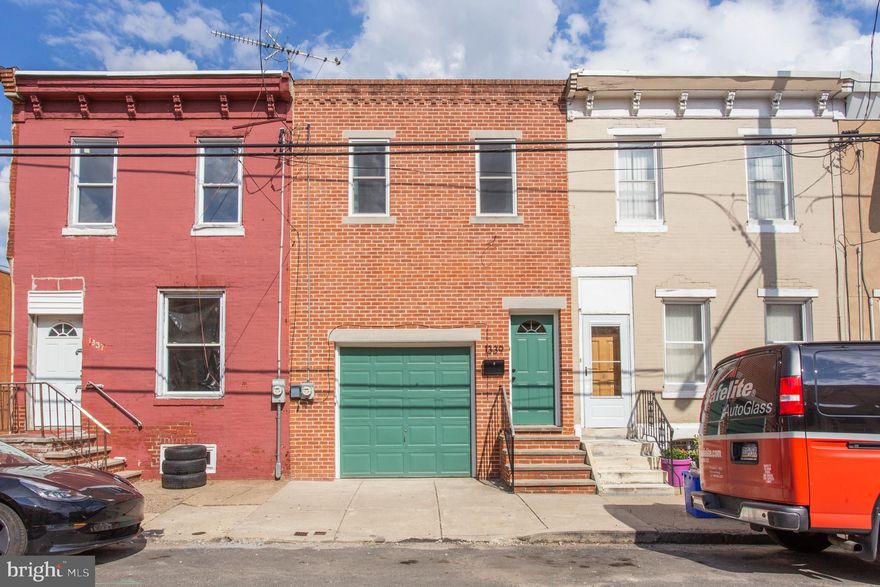 Close to everything in Point Breeze and with a Garage!  The main level of this home has an open floor plan with living room, kitchen, and large island with seating.  The kitchen has everything you'd need, including a dishwasher. Upstairs, there are two bedrooms and a four-piece bathroom.  The main bedroom is generously sized, and has a large walk in closet.  The second bedroom is large enough for a full sized bed and has a bay window and a closet.  The bathroom has a large soaking tub and a stall shower.  There is also an additional linen or storage closet in the hallway.  The basement is fully finished and could be used as a secondary living space, office, yoga room/gym, etc.  Laundry is also located in the basement.  The back patio is oversized compared to most South Philly patios, making for great BBQs, al fresco dining, or container gardening.  The garage has an electric opener and can accommodate a standard sized vehicle with a small amount of additional storage.  Tenant pays all utilities except water (water up to $50/mo included).  Pets may be considered at owner's discretion with additional pet rent. Owner/Landlord is a PA licensed Realtor.