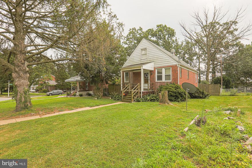 COZY 4 Bedroom 2.5 Bath Cape Cod in Parkville * Features Include:  COVERED front porch * Kitchen with breakfast bar * Hardwood floors * TWO bedrooms and one FULL Bath on the MAIN level * The second floor offers TWO bedrooms and a FULL bath * There is a HALF bath in the unfinished basement * SPACIOUS yard * With some TLC this could be an amazing home * There is also potential for a subdivision on this extended lot which would have to verified with zoning.
