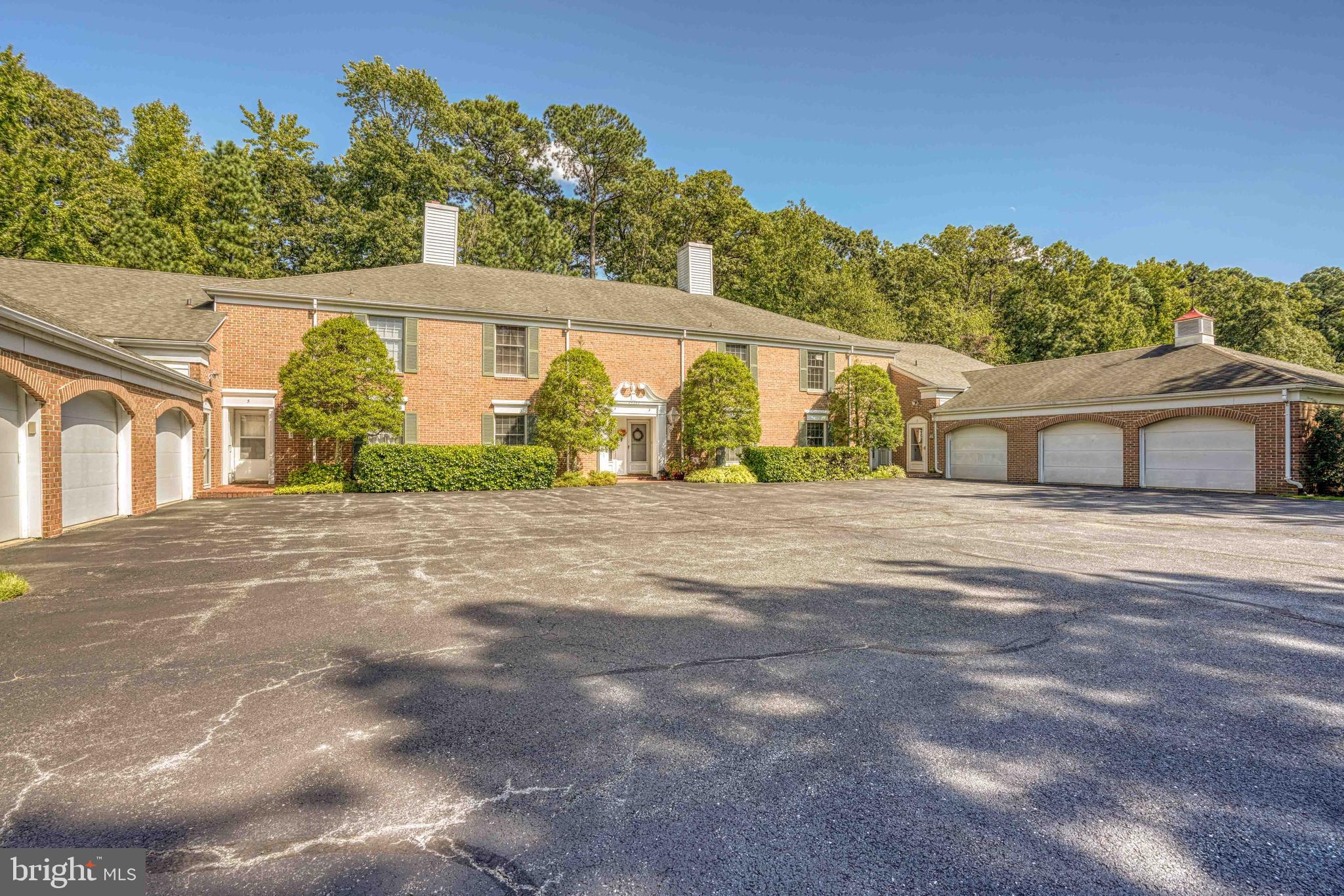 Welcome to Martingham, a premier golf course and waterfront community located just a mile from historic St. Michaels. This Widgeon Place condo offers two en-suite bedrooms and a half bath, with a thoughtful two-level layout designed for comfort and convenience. The main level features a kitchen with a charming breakfast nook, hardwood floors, a gas fireplace, and an open-concept living area. A bright sunroom opens to a private patio, ideal for relaxing or entertaining. Upstairs, the spacious primary suite includes a walk-out balcony, while the second bedroom is complemented by an en-suite bath. A second-floor laundry adds everyday ease. Perfectly situated in a sought-after location, this home combines style, function, and the best of Eastern Shore living.