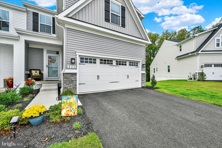 Skip the wait, skip the rising builder prices, and save thousands with this nearly new (10-month-old) end-of-group Caroline Villa backing to forest conservation. Unlike buying new construction, you can move in now, not 2026, and pay only half the MD & County transfer/recordation tax, a savings of about $6,000 compared to the builder. The new owners also enjoy the remainder of the builder warranty (mechanicals through 10/2026 and structural to 10/2034). This home offers the best of main-level living with a spacious owner’s suite featuring a deluxe double-shower bath and double bowl vanities, plus a true laundry room on the first floor. The kitchen stands out with gas cooking, upgraded cabinetry, and a vented range hood, flowing into the open living and dining areas. Upstairs find two additional bedrooms and a bonus room suitable for a study, exercise room or more. Step outside to a covered porch overlooking the woods, or enjoy the lower-level walkout basement to the yard, all perfect for entertaining or relaxing. Many stylish and smart upgrades can be found throughout, including tile finishes, low-voltage HD connectivity, and custom cabinetry touches. The owners especially love the peaceful porch views, the separate laundry room, and the way this home has plenty of space for company to stay. They’re excited for the community amenities coming soon, pool, pickleball courts, and barbecue areas. plus the new Goddard School opening nearby. Everyday conveniences are close at hand with grocery stores and restaurants minutes away. Nature lovers will appreciate Susquehannock State Park (10–15 min), Palmer Park (15 min), and the Ma & Pa Trail and Bel Air (about 20 min). Commuters will love being just 2 minutes to I-95, 10 minutes to Amtrak/MARC, and close to APG. With community quiet hours after 10 p.m., you’ll enjoy both connection and calm in a home that truly has it all. Move now, save now, and enjoy the best of new without the wait.