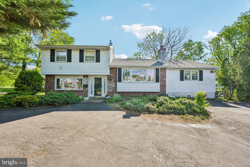 Welcome to this spacious split-level home nestled in the highly desirable Upper Moreland School District, located in the charming town of Hatboro. Surrounded by mature greenery and overlooking a peaceful branch of the Pennypack Creek, this property offers a unique blend of privacy, space, and opportunity.

Inside, you’ll find a versatile layout with 4 bedrooms, 2 full bathrooms, and 2 half baths. The main level features a bright living room with hardwood floors and a cozy wood-burning fireplace with a classic brick surround, flowing seamlessly into the eat-in kitchen with neutral white cabinetry, stainless steel appliances, and a sunny breakfast nook. Just off the kitchen, enjoy the convenience of a main-floor laundry room with a custom utility sink and an adjacent half bath.

The primary suite is thoughtfully located on the main level, offering a walk-in closet, private full bath, and access to a covered deck overlooking the serene backyard and creek—perfect for morning coffee or unwinding at the end of the day.

Upstairs, you’ll find three additional generously sized bedrooms and a full hall bath, with hardwood flooring beneath the carpeting. One bedroom even features a fun loft space—ideal for a playroom, reading nook, or creative retreat.

The lower level offers a warm and inviting family room with luxury vinyl plank flooring, a stunning stone-accented wood-burning fireplace with a large wood mantel, a half bath, and a mudroom with access to the covered patio and included hot tub.

Step outside to enjoy multiple patio spaces, a fenced-in yard, and a storage shed—all set against a naturally scenic backdrop. With plenty of parking and outdoor living options, this home is perfect for both relaxing and entertaining.

Located within walking distance to the Hatboro community pool and park, and just minutes from Route 611, you’ll have easy access to local shops, bakeries, and restaurants that make Hatboro so special.

Major updates include a new roof (2022) and water heater (2025). While the home offers incredible space, character, and setting, it presents an excellent opportunity for a buyer to add their own cosmetic updates and truly make it shine.

Don’t miss the chance to turn this hidden gem into your dream home!