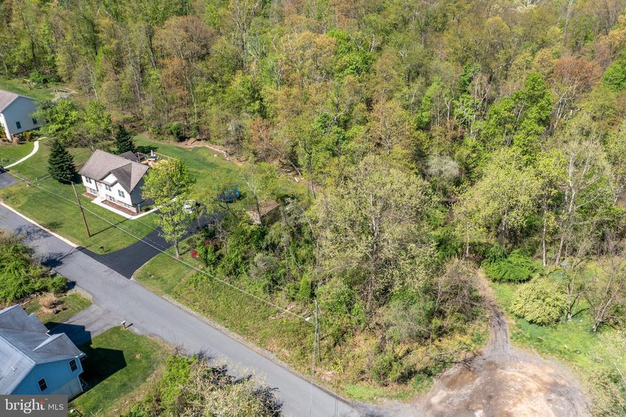 Ready to build your home in West Virginia?  Follow these country roads through Ridgeley to the place where you belong, the corner lot of Quail Drive! This charming street in Carpendale offers the amenities of electric, water and sewer hookup on a buildable, flat, lot conveniently located right across the bridge from Cumberland, MD, where you'll find lots of shopping, dining, entertainment and more! Not to mention this lot is located only 12 miles from Northrop Grumman, American Woodmark and many other job opportunities!
HIGHEST AND BEST OFFERS DUE SATURDAY, APRIL 27TH AT 2PM.