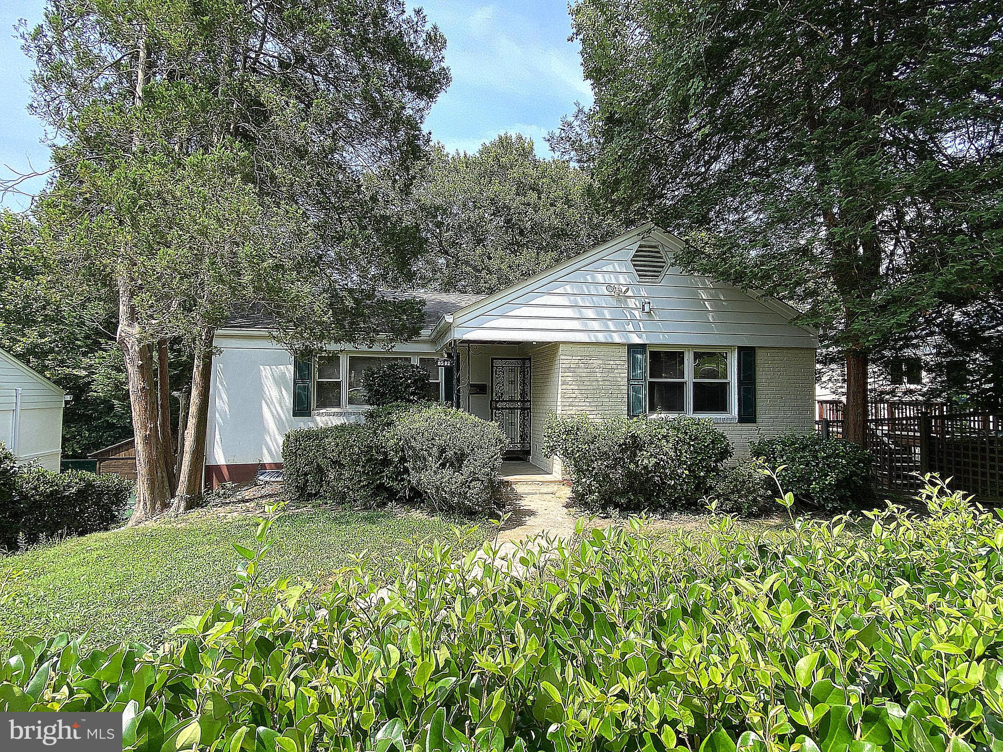 Welcome to this wonderful 4 Bedroom, 2 Bathroom home in Rock Creek Forest. Enter to a welcoming large living room on the main level with a fireplace and open feel that leads to a separate dining room. The kitchen offers a large pantry with easy access to the hallway leading to three main level bedrooms and a full bath. From the dining area, access the enclosed rear porch for shaded outdoor enjoyment. The basement offers a large family room, a bedroom, a bonus office/den, a walk-in closet, separate laundry area, and a full bath. Walk directly outside to the fenced rear yard and possibly catch a glimpse of local wildlife. The home also features a brand new A/C unit and fresh paint throughout. The ideal location provides access to shopping, dining, and also closeness to DC and I-495. Schedule a showing today.