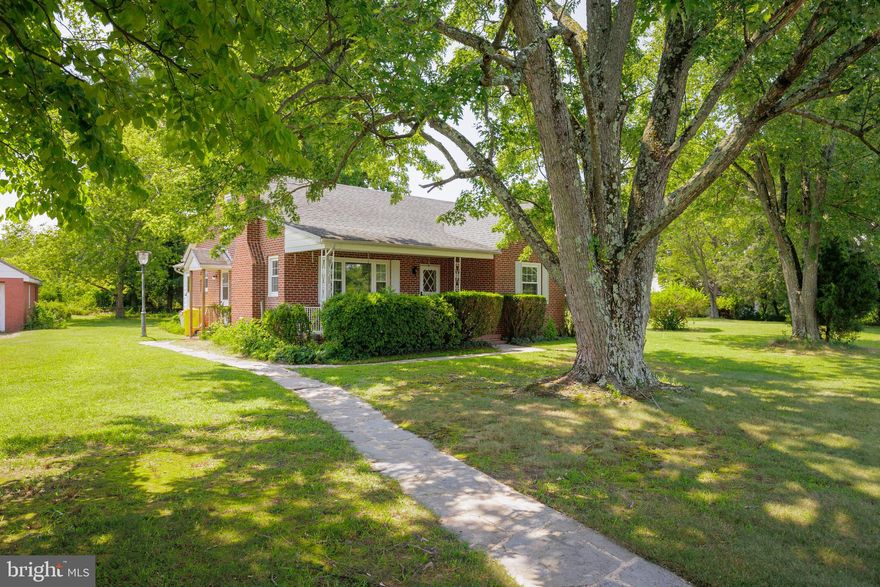 Welcome to 551 Old Oak Road, this charming 3-bedroom, 1.5-bath brick Cape Cod nestled on a generous 1.45-acre lot. Built in 1950, the classic brick facade exudes character and the lot and surroundings gives a private, secluded feel.
The main living area is adorned with large windows, allowing natural light to flood the space and accentuate the hardwood flooring that spans throughout. A cozy fireplace serves as the centerpiece, providing warmth and ambiance during cooler months.
The kitchen features a double oven, stainless steel appliances, gas cooktop and an abundance of cabinetry for all your culinary needs. A convenient dining area adjacent to the kitchen offers a comfortable space for meals and gatherings.
The main level features 2 bedrooms with a shared bath and upstairs is large bedroom with powder room. This home has an addition on the rear of the home with plenty of windows for natural light. 
The allure of this property extends outdoors, where the expansive 1.45-acre lot provides endless possibilities for outdoor activities, gardening, and relaxation. Imagine enjoying morning coffee on the charming front porch or hosting gatherings under the open sky. The mature trees and manicured landscaping create a serene backdrop for your outdoor endeavors.
A standout feature of this property is the spacious 2-car detached garage, offering ample room for parking, storage, and hobbies. This additional space is perfect for those seeking a workshop, a place to store recreational equipment, or simply to keep their vehicles protected from the elements.
Located in a desirable neighborhood, this Cape Cod home combines the tranquility of a spacious lot with convenient access to local amenities, schools, shopping centers, 97, route 100 and Fort Meade.
Seller is asking for highest and best offers due  Monday August 21, 2023 by Noon.
