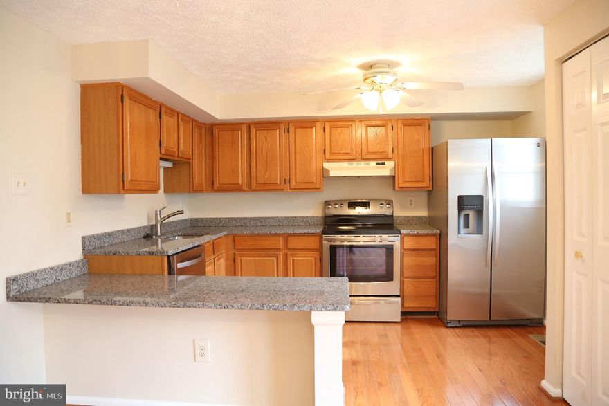 Wow! Bright, Airy, Beautifully Updated Townhouse in Convenient Location. New Granite Countertop, Stainless Steel Appliances, Hardwood Floor, Ceramic Tile, New Carpet, Fresh Paint. Walk out lower level with a huge rec room. Close to shopping centers and Major Highways.