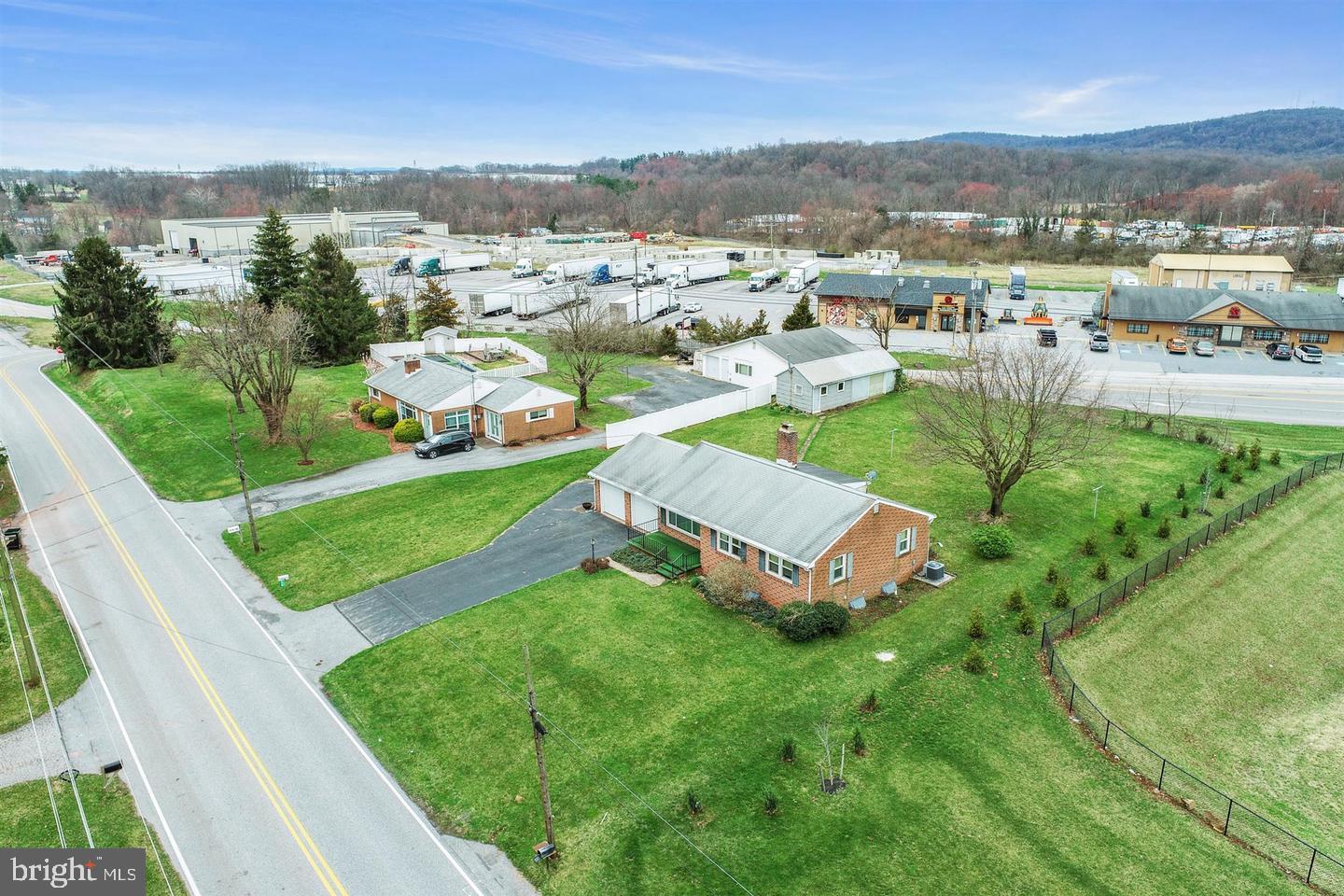 This sale includes 2 parcels totaling 1.04 Acres. Tax Parcel 23-000-NH-0162-00-00000 & Parcel 23-000-NH-0163-00-00000. The properties front both Cloverleaf Rd and Susquehanna Trail. They are adjacent to the Sheetz Convenience Store. There are 2 brick homes on the property, but this is a retail development site.