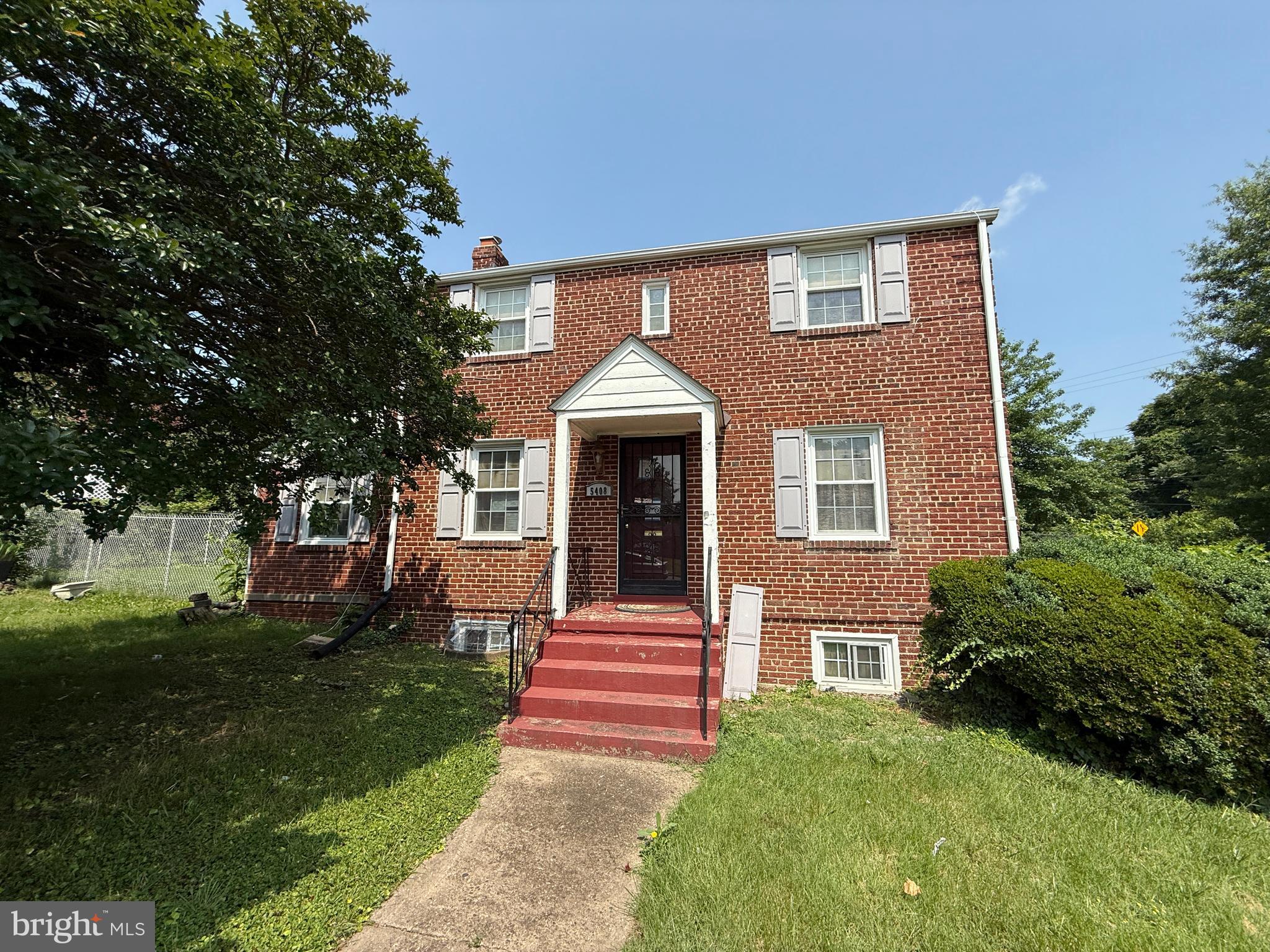 Discover the potential in this classic 3-level, 3-bedroom, 2-bathroom brick colonial, perfectly situated on a quiet, tree-lined street. Bursting with original character and timeless curb appeal, this home offers a solid foundation and a layout that’s just waiting for your personal touch. Step inside to find generously sized living and dining areas with hardwood floors, classic moldings, and large windows that fill the home with natural light. The traditional floor plan offers a spacious kitchen ready for reimagining, while the upper level features three well-proportioned bedrooms and a full bath. The lower level includes a second full bath and flexible space that can be transformed into a family room, guest suite, or home office. Outside, the stately brick exterior and fenced backyard offer a perfect canvas for landscaping or outdoor entertaining upgrades. Don't miss your chance to invest in a home with character, space, and location on its side.