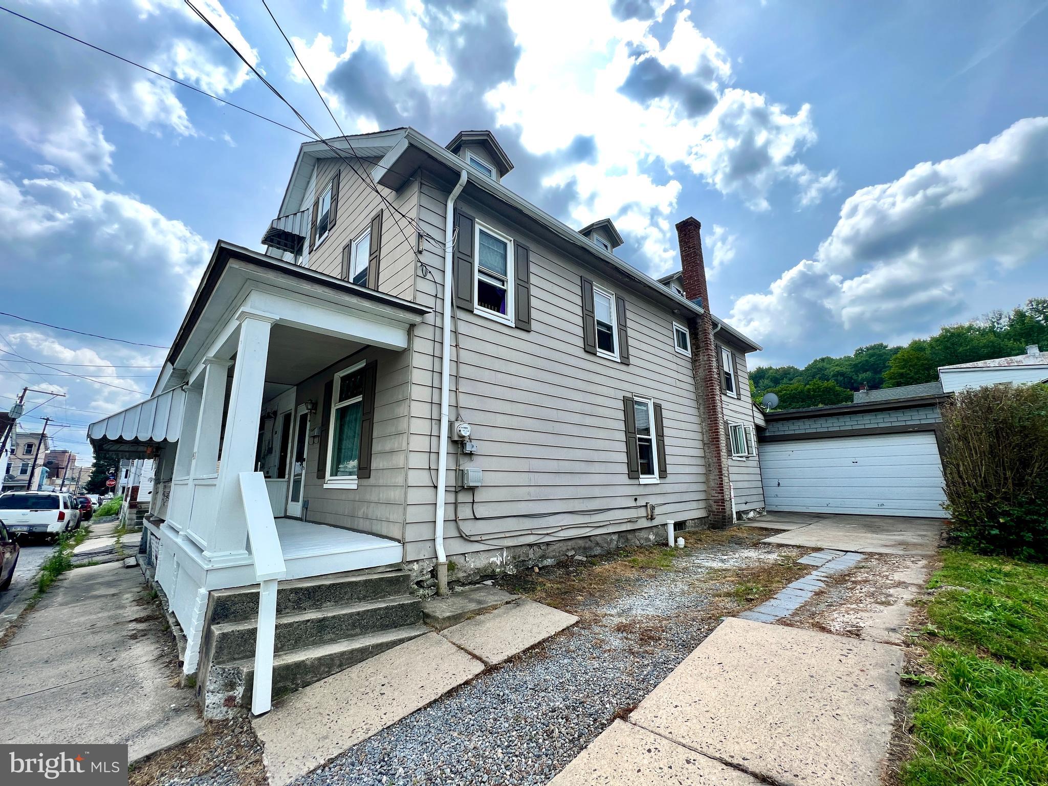 ***PRICE ADJUSTMENT*** Charming and Affordable! OWN for LESS than RENT! Welcome to this delightful single family twin in the heart of the growing community of Tamaqua! Featuring a 2 car garage, additional off street parking, modern kitchen, 4 Bedrooms and 2 modern bathrooms plus adorned with old world rustic charm of hardwood floors, original wood trim and stained glass window! Engage in delight when you enter the front door off of your covered porch to ravish in the beauty of old world charm as you gaze through the living and dining room adorned with original woodwork and stained glass accompanied by modern ceiling fan and original wood staircase leading to the second floor. Moving to the rear on the first floor you'll find a spacious modern kitchen fully equipped with appliances and laundry which leads out to a covered patio, rear yard and 2 car garage. On the 2nd floor you'll find 2 spacious bedrooms and 2 spacious and modern bathrooms. 3rd floor accommodates 2 additional bedrooms and additional storage space. The Tamaqua area boasts Arts, Entertainment, Education, Events, Fine Dining, community pool and much more. Several family oriented programs such as the Morgan foundation scholarship to Lehigh Carbon community College for graduating Tamaqua area students. All of this and for under 85K-LESS than RENT!! Call for more details and to schedule your viewing today!