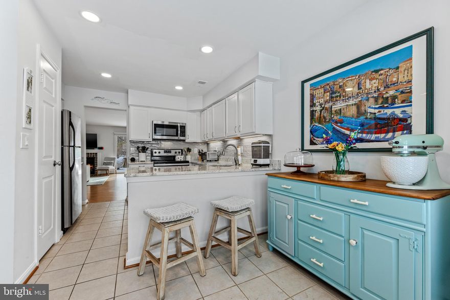 Schedule your showing today b/c it's sure to be gone quickly! Rare townhome for sale in the coveted community of Hunt Meadow, just 2.5 miles from historic, Downtown Annapolis. Picture yourself coming home from a long day at work and pulling into your dedicated parking space in front of this lovely home. The exterior, cedar siding on these townhomes is painted every 5 years & keeps the property looking fresh , unified and aesthetically pleasing. Step into your foyer and enjoy seeing a home that's been lovingly updated and welcomes you to relax and enjoy its attractive, current decor.  The large kitchen has stainless appliances, granite counters, a breakfast bar, large pantry, loads of cabinets and space for a table or desk . Attractive, real hardwood floors lead  into the living & dining area. You'll have plenty of space to accommodate formal meals & company. Relax in front of a cozy, wood burning fire in the large living area while seeing the soft snow fall on your private, rear patio. In warmer months you'll spend lots of time out here where your fenced yard backs to mature trees offering serene privacy. There is an attractive and convenient powder room located on the main level. 
Upstairs you'll find 3 bedrooms & 2 full baths along with your laundry area so you don't have to haul loads of laundry up & down a flight of stairs. The huge Master Suite sports a gorgeous, newly renovated bathroom with tasteful finishes, a double vanity and walk-in shower. Most major structural and mechanical systems are within 8 - 10 years of age or newer including the windows & roof. Ceiling fans are found throughout along with white, wood blinds upstairs and plantation shutters on the main level. 
Hunt Meadow has an active & affordable Homeowner's Association which coordinates seasonal, community activities. There is an outdoor swimming pool, that hosts a swim team, tennis/pickleball courts,  a basketball court and walking trails to keep you motivated & moving. Nearby Great Frogs Winery is a neighborhood favorite.