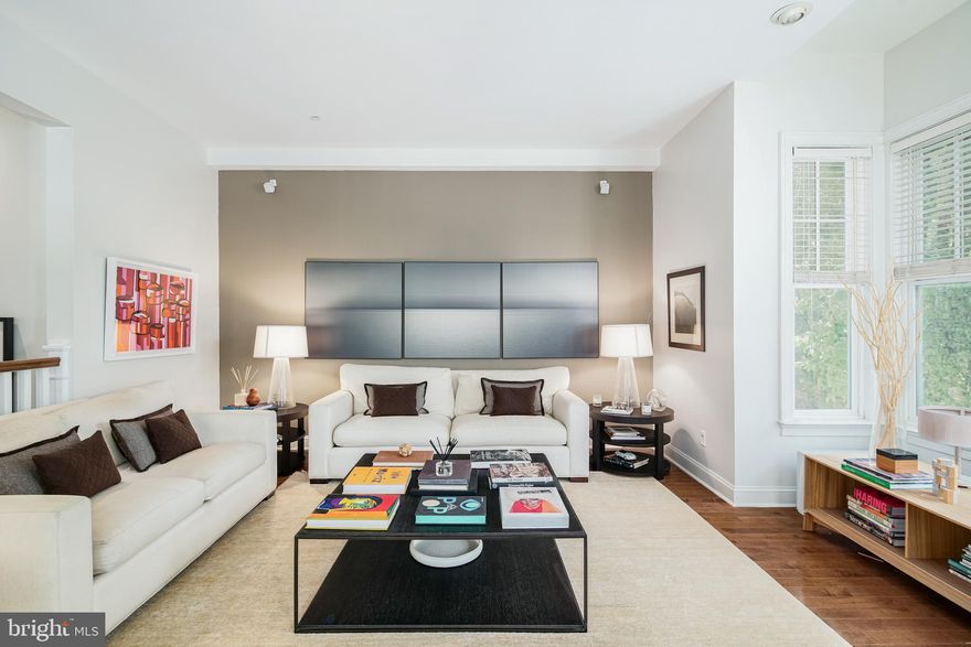 Welcome to 235 Gaskill Street! This exquisite, unique 4-bedroom corner property exudes warmth, elegance, and comfort. Boasting an impressive living space designed by famous architect Dado Castello Branco, a 2-car garage, and an elevator, this sun-drenched home offers a seamless blend of modern amenities that meets a classic style. Step inside and be greeted by a formal entrance that leads to a spacious den room with a wall of built-in shelving, a lounging area, and sliding glass doors that open to the shaded backyard. The patio offers ample space for outdoor furniture, grilling, container gardening, and more. Head upstairs to the second floor and discover a bright and sunny living area with 10-foot ceilings, bay windows, and a fireplace.Hardwood floors and large windows flood the space with natural light throughout the entire property.  Adjacent is the open-concept chef’s kitchen, featuring custom cabinetry, Viking appliances, granite countertops, an island, and a formal dining area. This second-floor space is perfect for entertaining, complete with a half bathroom and a private balcony. The third floor houses the primary bedroom with large windows, huge custom walk-in closets, and an all-marble bathroom with double sinks, a glass shower, and a soaking jetted tub. This floor also includes an additional bedroom and a second full marble bathroom. Finally, make your way to the top floor to find 2 more bedrooms with a middle bathroom.  Each of these bedrooms features its own private balcony. The bigger bedroom has 2 built-in beds and a custom walk-in closet organizational system. Located in the highly desirable Society Hill, this home is tucked away on a tree-lined street in the prestigious Liberty Court, maintaining a quiet neighborhood feel while still offering all the convenience of city living. Take a short walk to the picturesque Washington Square Park or visit the charming 3 Bears Park, just a few blocks away. You're also only a 2 -minute walk from the Headhouse Square farmer’s market, which runs year-round! This exceptional location also boasts access to many restaurants, attractions, venues, shopping, and grocery stores! Plus, enjoy easy access to the Delaware River waterfront attractions and I-95 to get in and out of the city. Don't miss out on the opportunity to own this stunning property and live in one of the most coveted neighborhoods in Philadelphia. Schedule a tour today!