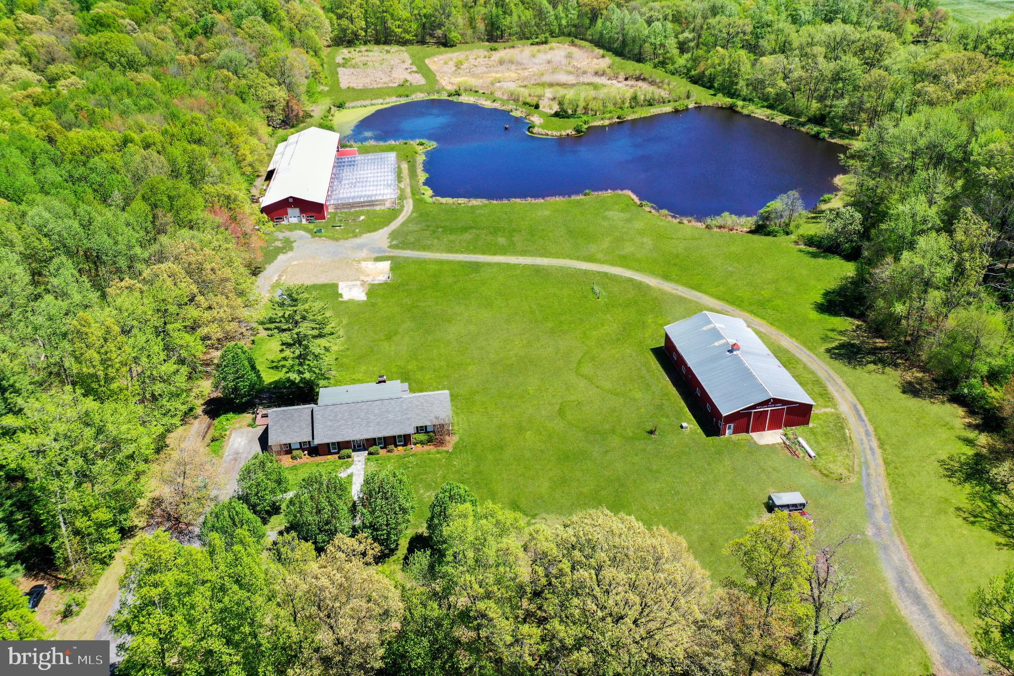 To be sold as an entirety - 2 separate parcels of land, 19+ acres total, with house, barn, greenhouses, shop/machinery shed, and 2-acre pond. A total of 3 AG Development Rights, not encumbered by a conservation easement. 2-Story Home with vinyl plank wood tone flooring throughout. Kitchen with granite counters and stainless steel appliances; and living room with stacked stone fireplace. There is a main level and second level primary bedroom suite with private bath. Lower level family room, office, full bathroom, storage room and utility room. Large rear Trex deck overlooking pond. 1990 Morton Shop Building with electric service on separate meter. Steel barn attached to Van Wingerden Greenhouses. There is an adjacent 13+ acres unimproved parcel - Tax Map 43, Parcel 107, Tax ID No. 02-068214 which is available to be purchased for $300,000. Parcel 107 has 2 AG Development Rights. Parcel 107 will not be sold separately from the 19+ acres Farm until after the Farm has been sold. The Buyer of the Farm is not required to purchase Parcel 107 as a condition of purchasing the Farm. See MLS documents for detailed brochure and Seller disclosures.