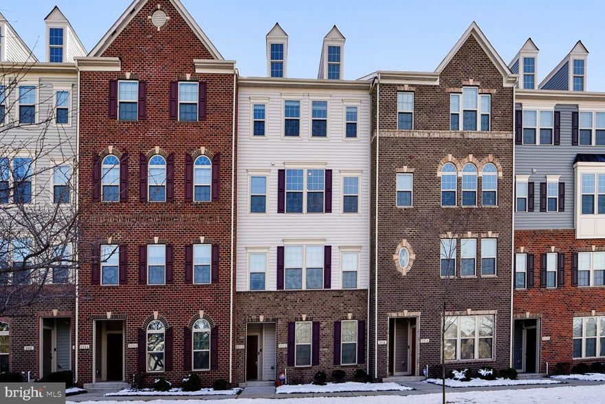 BETTER-THAN-NEW two-level LUXURY townhome  attached ONE CAR GARAGE shows like a model!  Built in 2016, this Ryan "Picasso" model is a HUGE home, with   2700 square feet, THREE BEDROOM and TWO AND ONE HALF BATH and has been gently lived in and lovingly cared for.   Wonderful upgrades include GOURMET KITCHEN  with Stainless Steel appliances, granite counter tops, over-sized island with seating, a built-in office area, and gleaming wood floors.  Spacious Owners' suite includes large WALK-IN CLOSET, tray ceiling and bathroom with corner shower w/seat, upgraded tile work, two separate vanities, and 'water-closet' for privacy.  Separate Laundry room with cabinetry is on bedroom level.  Upgraded finishes throughout!  Covered deck!  Conveniently located with easy access to NSA/Ft Meade,  BWI, Annapolis, MARC train, commuter routes, and walking distance to grocery shopping and restaurants.   Easy living at its best!  Don't miss it!