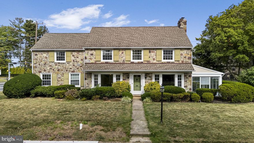 This stately stone-front colonial blends timeless charm with rare versatility. Set on a corner lot, the home showcases classic 1940s craftsmanship with original plaster walls, detailed trim, and preserved original fixtures. The solid construction provides a strong natural sound barrier, giving you a remarkably quiet, comfortable living environment—proof that timeless design and quality materials stand the test of time and accommodate today's modern lifestyle.

The most unique feature is the private main-floor suite with its own exterior entrance and the ability to be locked off from the rest of the house. Ideal for an au pair, in-law suite, guest quarters, or a dedicated business area, it’s move-in ready as-is and could easily accommodate a future bathroom for potential rental income, or even for your in-law's convenience (I mean, even though there IS a half bathroom on the main level already, why not add some value and pop in a full one).

Inside, enjoy a spacious living room with a wood-burning fireplace, a formal dining room, and a sunroom with a breeze that captures both sunrise and sunset. Off the kitchen and foyer is a cozy breakfast nook—perfect for casual meals or coffee breaks. The kitchen itself features warm cabinetry, granite counters, stainless steel appliances, and a charming Dutch door that opens directly to the driveway for convenient access to the oversized two-car garage. And between the garage, the wide private driveway, and the remarkably open street parking, this home is truly social-gathering ready. You’ll never worry about where guests will park, that's for sure. 

Upstairs, you’ll find a large primary suite with a walk-in closet and its own bathroom, plus three additional generously sized bedrooms and a newly renovated full hall bath. From the hallway, you’ll also access the attic—offering an unbelievable amount of storage, with sturdy pull-down stairs that make it safe and easy to use. The basement provides even more storage and retains its original coal room—a historic feature from the home’s mid-century era—alongside dry, usable square footage.

Added bonuses include the sheer convenience of having all of Springfield and Haverford’s shopping within a 15-minute drive, as well as plenty of stores and eateries within a one-mile radius. A favorite is the iconic Llanerch Diner, famously featured in Silver Linings Playbook with Jennifer Lawrence and Bradley Cooper.

Words alone can’t capture everything this home has to offer, inside and out. Come see for yourself and find your forever at Ormond—make your move today.