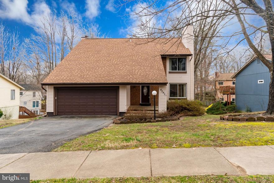 Great location. 6 bedroom, 3 1/2 bath home in desirable Montclair Country Club. Plenty of remodeling and upgrades. Brand new soft close kitchen cabinets and new granite counters. 2 wood fireplaces to keep you cozy and 12 fans to keep you cool. New upgraded carpet downstairs. All bathroom vanities and counters have been replaced. New laminate flooring in dining room and family room. Replacement vinyl windows. Architectural shingle roof new in 2015. Siding installed in 2002. Double tier deck to enjoy the outdoors. Extensive hardscape in rear yard. Within walking distance to the beach and lake. Buses to the Pentagon stop at the next corner making commuting extremely easy. Newer insulated double garage door. Extra storage room over the garage with a pull down ladder.