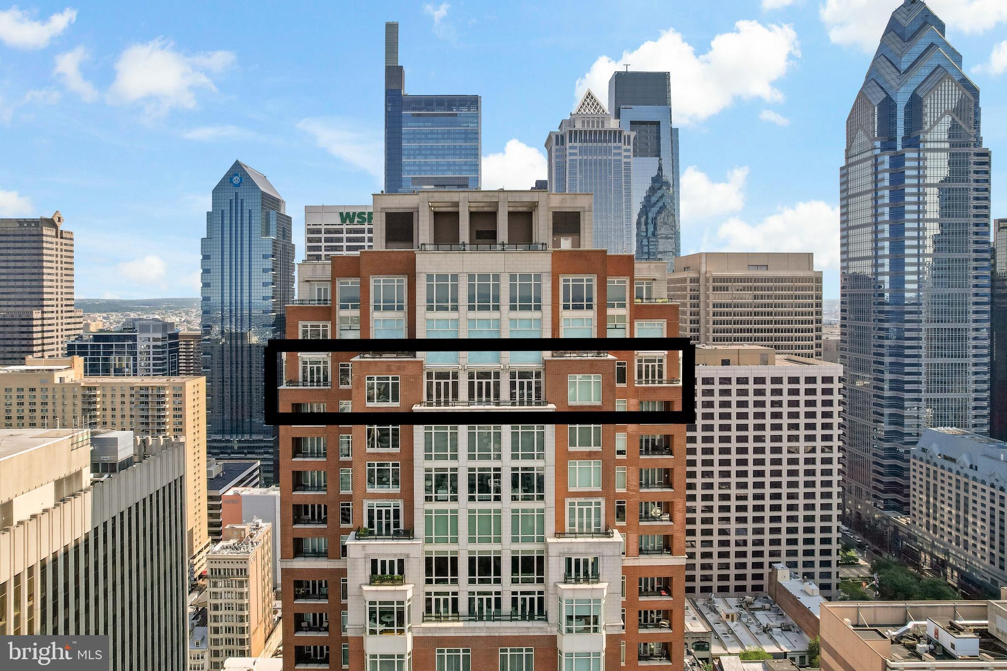 Welcome to Unit 3102 at 10 Rittenhouse, an extraordinary nearly full-floor residence offering approximately 5,400 square feet of refined, light-filled living space high above Rittenhouse Square. This home delivers the scale and comfort of a modern townhome, elevated by the white-glove amenities and prestige of one of Philadelphia’s most iconic buildings.
An incredibly rare offering, the unit includes four garage parking spaces—two of which are the ultra-coveted self-park spots located within the building’s garage, along with two additional valet spaces, providing flexibility and convenience that is nearly impossible to find in Center City.
Inside, the residence opens to sweeping 270-degree skyline views centered on Rittenhouse Square, visible through floor-to-ceiling glass double doors and three separate balconies. Natural light fills every room, creating a sense of openness and calm that is matched by the clean, contemporary design throughout. The main living and entertaining areas are expansive and welcoming, anchored by a custom-built wall unit that houses a 100" television and includes a hidden door accessing the AV closet. It is complemented by a beautifully designed bar equipped with a wine fridge, ice maker, sink, and a truly massive walk-in pantry that functions as a secondary prep space or staging area for entertaining.
The dining area is perfectly positioned just off the kitchen, facing southwest, where you’ll enjoy open, unobstructed corner-window views that stretch toward the skyline and flood the space with golden afternoon light. The flow from kitchen to dining to living is effortless and designed for both large-scale entertaining and intimate daily living.
The primary suite is a retreat all its own—thoughtfully laid out and filled with soft natural light. It features three dedicated closets, including two walk-ins and a spectacular L-shaped dressing closet with an east-facing window. The spa-style bathroom includes a separate water closet, a jetted soaking tub with an east-facing window and wall-mounted TV for cozy baths, and two separate vanities. Just beyond the dressing room is a third vanity, ideal for makeup or grooming. The enormous walk-in closet, fully customized by California Closets, feels worthy of a magazine feature. Past the dressing room, a tranquil home office space offers complete privacy, ideal for focused work or quiet reflection, and opens to its own east-facing balcony with morning light and city views.
Two additional bedroom suites are located off a den on the west side of the home. Each includes an en-suite bathroom and generous closets, offering flexibility for guests, family, or remote work setups. There are two separate laundry areas—one tucked discreetly into the primary suite and another off the kitchen—adding function and convenience to daily living. The entire residence is equipped with a range of powered sunshades, blackout shades, and draperies, and features a fully customized Lutron lighting system. More than a dozen zoned climate controls ensure year-round comfort, room by room.
Living at 10 Rittenhouse includes access to five-star amenities and services, including 24/7 concierge, a state-of-the-art fitness center, indoor pool, hospitality suite, chauffeur-driven house vehicle, and more. The building's discreet entrance on 18th Street places you just steps from the city’s best dining, shopping, and cultural institutions.
This is a rare opportunity to own one of the most spacious, private, and refined residences in the city—designed for those who value scale, light, and luxury at the highest level.