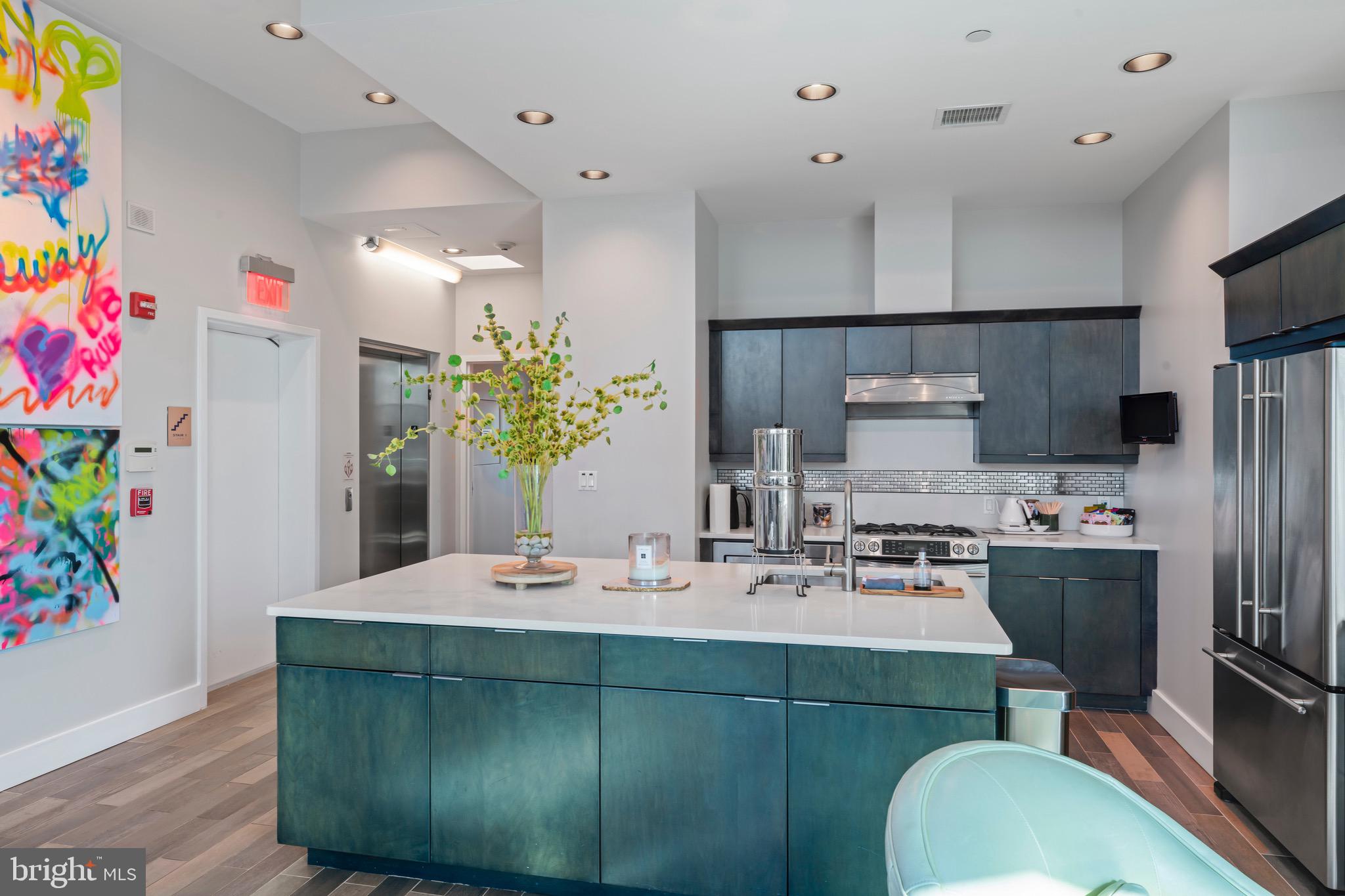 Stunning full-floor penthouse with private elevator access opening directly into the unit. Enjoy high ceilings, gas cooking, and top-tier appliances throughout. Spacious balcony plus a large private rooftop terrace perfect for entertaining or relaxing. No shared walls—true privacy in the heart of Bethesda. Steps to shops, dining, and Metro. Located in the heart of the Woodmont Triangle.