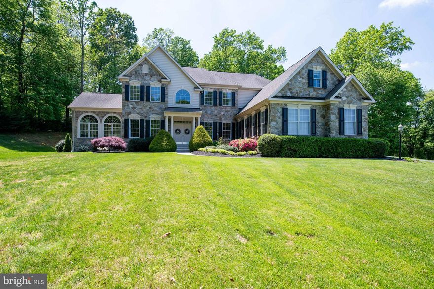 The ultimate stone front custom home with the most amazing in-law apartment anyone could imagine!  See the remainder of the remarks for all the details of the In-Law Suite!  Located in the highly desirable community of Holden Hill, this home boasts a mature community feel with a beautiful setting and stunning homes.  The front walkway leads you past gorgeous landscaping to the double door entry.  Once inside, you will be impressed with the great open floor plan , quality finishes and natural light filled home.With over 5,000 sq feet of living space on the main and upper levels, rooms are spacious and airy.  Some of the amenities include a gourmet kitchen with island and gas stove top and wall oven. Directly off the kitchen you find yourself in the breakfast room, which is surrounded by windows and slider leading you to  the private backyard with a large paver patio to host any size gathering.The living room is comfy and cozy with a gas fireplace and stone mantle.  To complete the first floor you also have a large open dining room, home office, a sitting room, laundry room and sunroom.  On the upper floor you will find the master bedroom suite with a double door entry, a large bedroom with a gas fireplace, an enormous walk in closet and direct access to the 2nd floor balcony.  The master bath offers a fully tiled shower with bench seat, a separate corner soaking tub and two separate vanities. Adjacent to to the master suite there's another bedroom or office with access to the 2nd floor balcony and a Jack and Jill bathroom which leads into an oversized bedroom located over the 4 car garage. This bedroom offers its own sitting area as well as a huge walk-in closet.The lower level offers the In-Law Suite of all In-Law suites!  Complete with a dedicated, private entry to the lower level via a paver walking path from the driveway, a full size kitchen, living room, two large bedrooms and its own laundry room. Down the hall from the In-Law Suite there is an exercise room and a large theater room.  The lower level offers nearly 2,000 sq feet of finished area.Located on the southern edge of Westminster, this home is located close to nearly everything, including Owings Mills, Baltimore, Rt 795 and Rt 695.  This is a one of a kind home with so much to offer.  Don't miss your opportunity to own this special home.  Check out our video tour link of the home- http://properties.myhouselens.com/mls/27391/