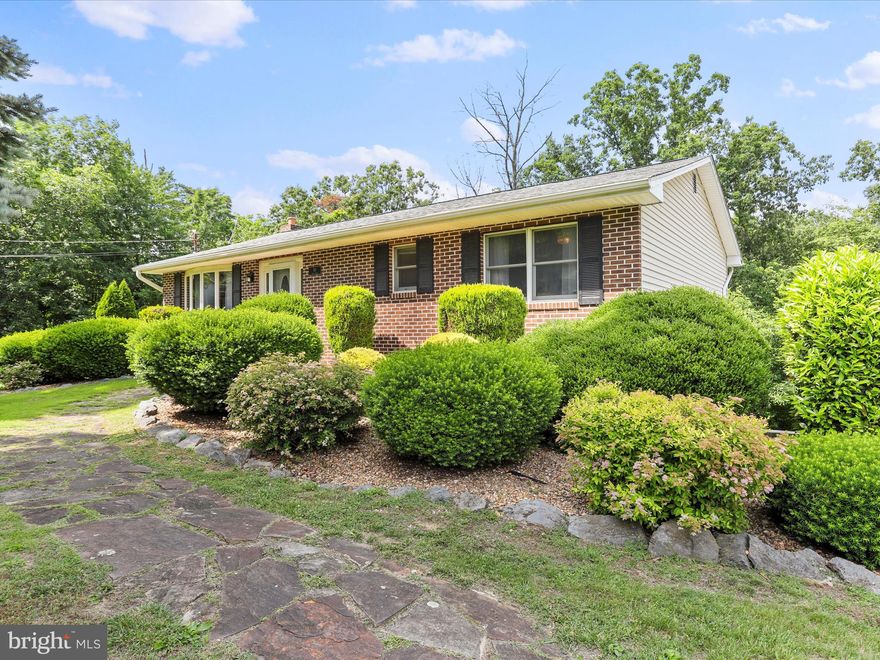 Tranquility awaits at this tree lined .47 acre lot in Martinsburg. This 3 bed 2 bath house is ready for its next owner.  As you step through the front door, you’re welcomed by a cozy living area that seamlessly flows into a modern kitchen equipped with stainless steel appliances. Adjacent to the kitchen is a dining area that opens up to a Trex deck, offering a perfect spot for morning coffee amidst the chirping birds and greenery. The main floor also houses a primary bedroom complete with an ensuite bathroom, two additional bedrooms, and another full bathroom. The lower level features a second living area, complete with a built-in bar and wine rack, a wood stove for those chilly evenings, and a laundry area. The garage, accessible from this level, accommodates one vehicle and includes additional space that can be utilized as a workshop or storage area. Outside, a covered concrete patio surrounded by mature trees and well-maintained landscaping provides an ideal setting for outdoor entertaining. This home, cherished and meticulously maintained by the owners for the past 20 years, is located at the end of a cul-de-sac, offering the perfect balance of seclusion and convenience. With easy access to local amenities and interstate 81 for commuting, this home could be your peaceful retreat. Make this your home today!
