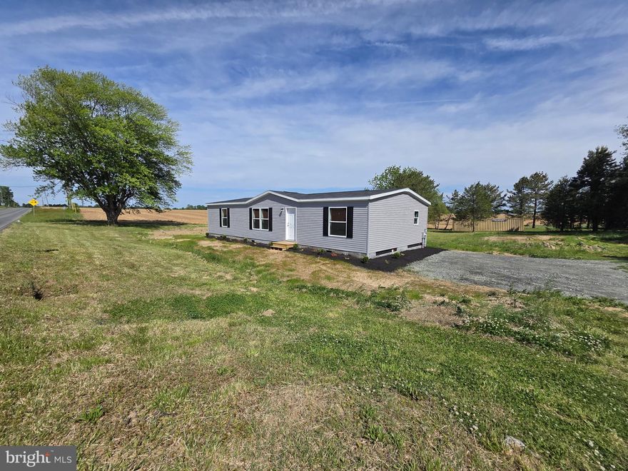 Brand New Champion Homes, Double Wide on a gorgeous 3/4 acre lot.  3 bedrooms, 2 full baths, over 1500/SF of living space! Well and septic inspected and up to code. Bright, open and beautifully designed. This is a rare opportunity to enjoy a brand new home on a gorgeous lot.  Rural setting but just minutes away from every desired amenity.  Schedule a tour and make this beauty yours today!