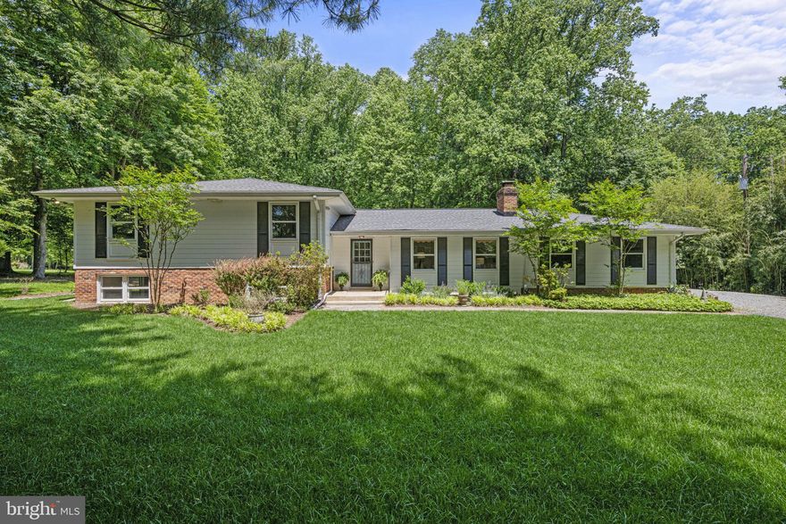 Natural beauty abounds as you come down the long private driveway and into the peaceful, serene two acre setting surrounded by old growth trees providing glorious privacy.  Walk through the front door and instantly feel the stress of the day start to fade as you see the gorgeous hardwood floors of the Living Room  with its warming hearth and wood burning fireplace.   The all white, newly renovated (2020)  Gourmet Eat-In Kitchen with Stainless Steel appliances and the fashionable white subway tile backsplash is perfect for those who love to cook. The space is large so it will easily accommodate a dining table. There's a wonderful wall of built-ins and display shelving.  Off the Kitchen you'll find a stunning retreat in the gorgeous Sun Room/Family Room addition with new windows on three sides and new entry doors (2022).  The Sunroom/Family Room overlooks the lush green backyard. Upstairs you'll find four spacious Bedrooms including the Primary Suite with its renovated (2021) stylish Full Bathroom boasting a spectacular White Marble shower with a rain shower head and another Renovated (2021) Hallway Full Bath with a tub/shower combination. Downstairs is a sunny and bright, large Recreation Room with new premium, durable LPV (luxury plank vinyl) floors perfect for kids of all ages.  The Recreation Room with sliding glass doors opens to a charming patio space with fieldstone wall.  In addition to the Rec Room, there's a generously proportioned Study/Den and a Full Bath plus the separate laundry room on this level.  One more short flight of stairs down and you'll find enormous unfinished Storage Space/Utility Room for a home workshop or for  all the things you want to keep safe and out of sight. The breathtaking, natural oasis that is the rest of this property needs to be seen to be truly believed, but rest assured you will find no shortage of beautiful scenery and local wildlife.   Great bird watching, too!  Talk about move-in ready...This home has loads of upgrades - Upgraded 200 amp electric service with new circuit breaker box & meter; New heat pump (2020), new hot water heater (2020); new roof & new attic fan (2020). Replaced well pump, well tank and water softener (2021).  New ADT security system (2021); freshly painted interior (2023) and exterior (2020).  Upgraded electric for a generator and 2 high-amp outlets for EVs. This home has everything you could want!  All this and an incredible location south of Potomac Village,  close to I-495, the Beltway to Tyson's Corner, Downtown DC or north to the I-270 BioMed Corridor and within minutes of Great Falls National Park and the C&O Canal.  It's a prize!  Churchill school cluster too!!  Don't let it get away!  Come see it today!