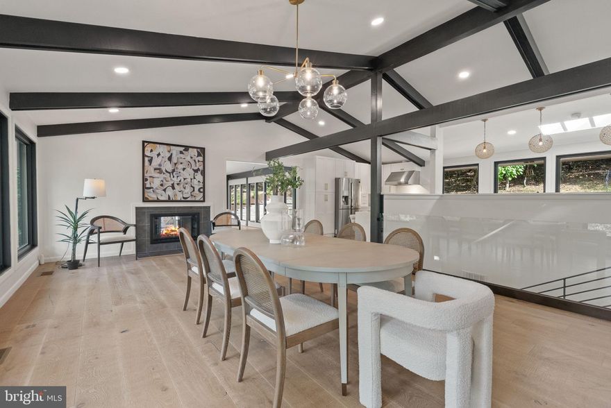 Welcome to 1335 N Pegram Street—a home that feels like a retreat right in the middle of Alexandria. Tucked away on nearly two acres in Seminary Hill, this mid-century modern beauty offers incredible privacy, open and light-filled spaces, and thoughtful updates throughout. *From the moment you arrive, the setting feels special. The house sits well back from the road, surrounded by trees, giving you a sense of calm and space that’s hard to find so close to the city. Inside, more than 80 windows let in natural light from every angle, creating a warm, inviting atmosphere in every room. *With 4,200 square feet of liveable space, there’s room here for every part of life—whether you’re hosting gatherings, working from home, or finding a quiet corner to recharge. Five bedrooms and five full bathrooms provide ample flexibility, including two large main-level suites that are ideal for in-laws, guests, or an au pair. Upstairs, the primary suite feels like its own retreat with a spa-like bath, custom closet, and private patio. *The heart of the home is the kitchen and living areas. The modern kitchen is designed for both everyday living and entertaining, with sleek finishes, generous counter space, and top-quality appliances. The dining room and sun-filled living room flow seamlessly into the outdoors, allowing you to enjoy cozy nights by the fireplace or open the doors to take in the view of the surrounding trees. *If you’re a nature lover, this property is truly special. Towering trees surround the home, creating a peaceful backdrop that changes beautifully with the seasons. Wildlife is part of the daily rhythm here—deer wander through, birdsong fills the mornings, and fireflies light up summer evenings. It’s a serene, natural setting that makes the home feel miles away, even though you’re just minutes from the conveniences of Alexandria. *Location adds to the appeal. Just down the road, Inova Alexandria Hospital is minutes away—perfect for medical professionals seeking a short commute. Easy access to I-395 makes it quick and convenient to get to Washington, DC, the Pentagon, or National Airport. Old Town, Del Ray, and local shops and restaurants are also nearby, allowing you to enjoy both a quiet retreat and a connected lifestyle. *Everyday conveniences are built in—a welcoming mudroom entrance, a spacious laundry room, a two-car garage with new doors, and a reinforced parking pad that gives you options for the future. *The current owners spent six years carefully remodeling and expanding the home, preserving its mid-century character while incorporating updates that make life easier today. The result is a home that feels both stylish and comfortable—a rare combination. *If you’ve been looking for a place that offers privacy, character, and plenty of space to live the way you want, 1335 N Pegram Street is ready to welcome you home. Special note:  Measurements deemed highly reliable but not guaranteed - 3830 finished SF from city tax records, 470sf garage, 1347sf deck, 490sf screened porch,  155sf balcony.