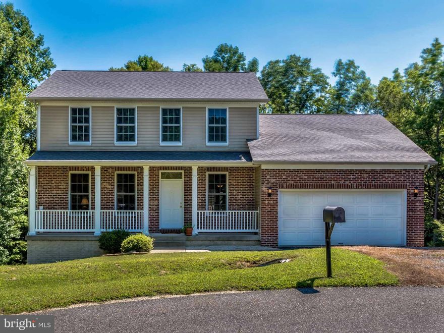 *** HUGE PRICE REDUCTION***  Beautiful colonial includes 2.41 acres of private property located at the back of a quiet neighborhood. Home features gleaming hardwood floors thru-out main level, spacious walk-in pantry in large kitchen, family room w/ fireplace insert, formal LR/DR, 3 bd, 2.5 ba, carpet upstairs, walk out basement includes plumbing rough in, covered front porch, 2 car garage.