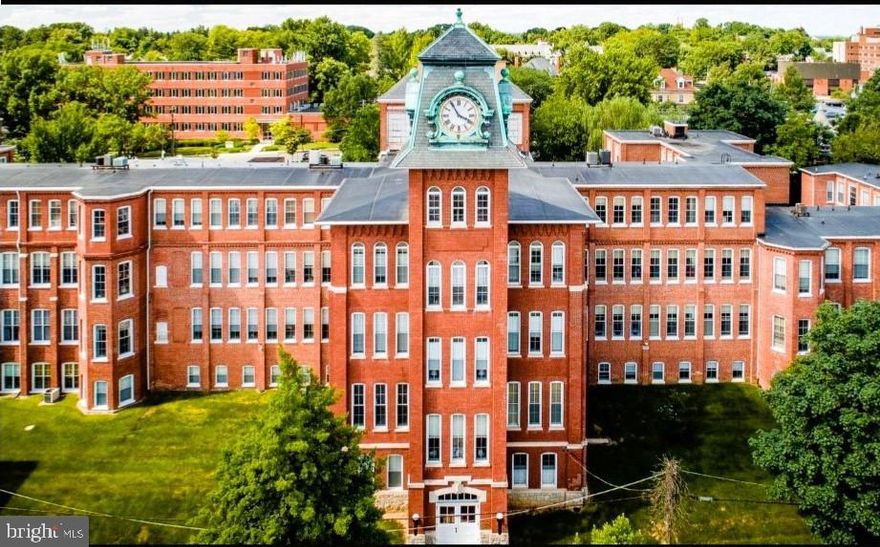 *** NEW PRICE 10/10/25 ***  Move-in ready Clock Towers 2 bedroom / 1 bath condo!  Ideally-situated 1st floor corner unit with 10 windows and southern exposure providing lots of natural light.  Other highlights include a large living room and dining area with original exposed brick wall/column architectural elements, 11 foot ceilings, tall windows, and deep window sills.  Convenient access to mailboxes, exterior entrances, and parking lots.  Entire unit freshly painted.  New lighting fixtures, plumbing fixtures, and garbage disposal.  New carpet in 2023.  New washer/dryer in 2022.  New HVAC system in 2018.  Building amenities include secure access, community party room/lounge, fitness center, sauna, common seating areas in hallways, and an outside patio.  Unit must be owner-occupied... no new rentals allowed at this time.  (Note: The seller is a licensed PA realtor and the listing agent)