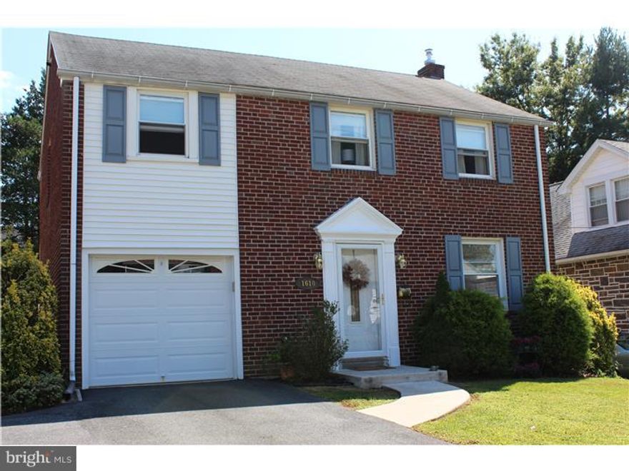 This two story colonial welcomes you with its manicured lawn and brick exterior. Single car garage with expanded driveway for additional parking. Walk into the spacious living room with beautiful original hardwood floors. Cozy dining room, up-dated kitchen with breakfast bar, decorative tiled backsplash and new countertops. Step into the fabulous sunroom addition surrounded by large windows and tile flooring, this room spans across the entire width of the home, great for entertaining. The convenience of laundry and powder room are also on the main level. The 2nd floor offers a large master bedroom with two closets, two additional bedrooms and tiled hall bath. The finished basement is ideal for workout room and plenty of storage. The large fenced-in level back yard is "park-like" with evergreen trees and a terraced patio for those weekend barbeques. New replacement windows throughout. Must see! Make an appointment today!