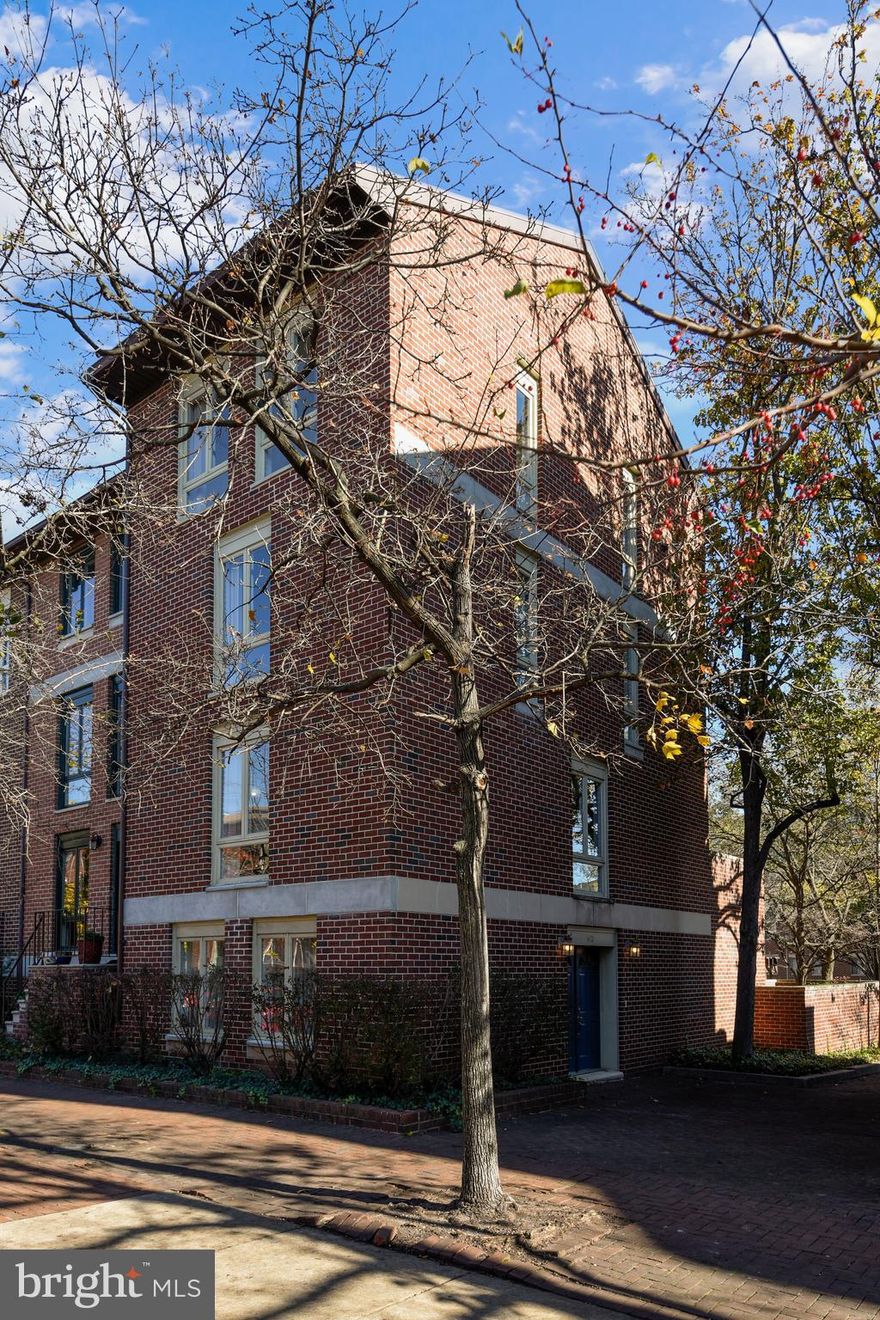 Located on Wheel Park, one of the most picturesque, tree-lined locations in Otterbein, 613 S. Hanover Street is one of the largest and best-sited HarborWalk townhomes with 4 stories and 2,304 sq. ft. of finished living area.  This lovely end-of-group has been refreshed throughout and enhanced with fresh paint and new carpet to make moving in easy!  You'll love the unique side orientation of this home, as only a handful of  HarborWalk townhomes were built in this manner. This orientation along with a grade level entrance provides ease of entry and a more open and welcoming foyer.  The first level offers a versatile first level family room with French doors and new carpeting, a powder room and laundry/utility room which connects directly to the 1-car garage. You'll also appreciate the convenience of having two additional in tandem parking spaces on the rear parking pad.  The second level living and dining rooms are awash in light from two sides of large windows.  Gleaming hardwoods, a wood-burning fireplace and a neutral palette create such a warm and welcoming living area. The spacious and private rear deck is ideal for enjoying the outdoors, grilling and entertaining family and friends.  The eastern exposure means sunny mornings and cool evenings entertaining outside.  Ascend to the 3rd level and you'll find a cozy loft, perfect as a home office or den. The bright bedroom offers southern and western exposures, as well as views of Wheel Park and a charming cobblestone lane. The fourth level completes the home with two more spacious bedrooms offering great closet space and more gorgeous neighborhood and park views.  A membership to the popular Otterbein Swim Club is available!  Check out the walk score of 92 with easy access to the MARC, Camden Yards, the central business district and Federal Hill coffee shops, markets, restaurants and the Inner Harbor.   Easy to show!